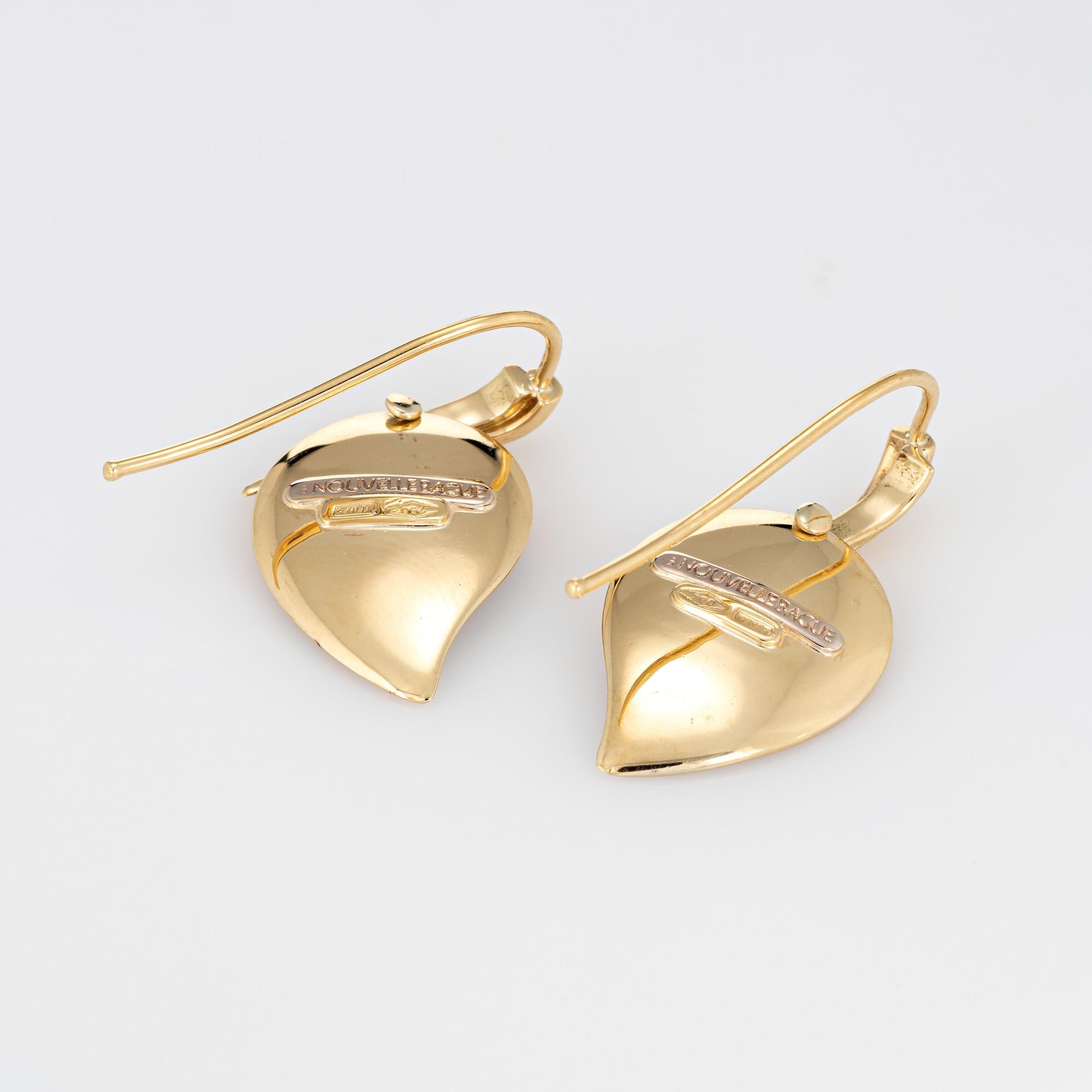 Fine detailed pair of La Nouvelle Bague earrings crafted in 18k yellow gold. 

Pink enamel is set into the mounts (in excellent condition and free of cracks or chips).  

The stylish earrings are set with whisper pink enamel in leaf drop mounts. The