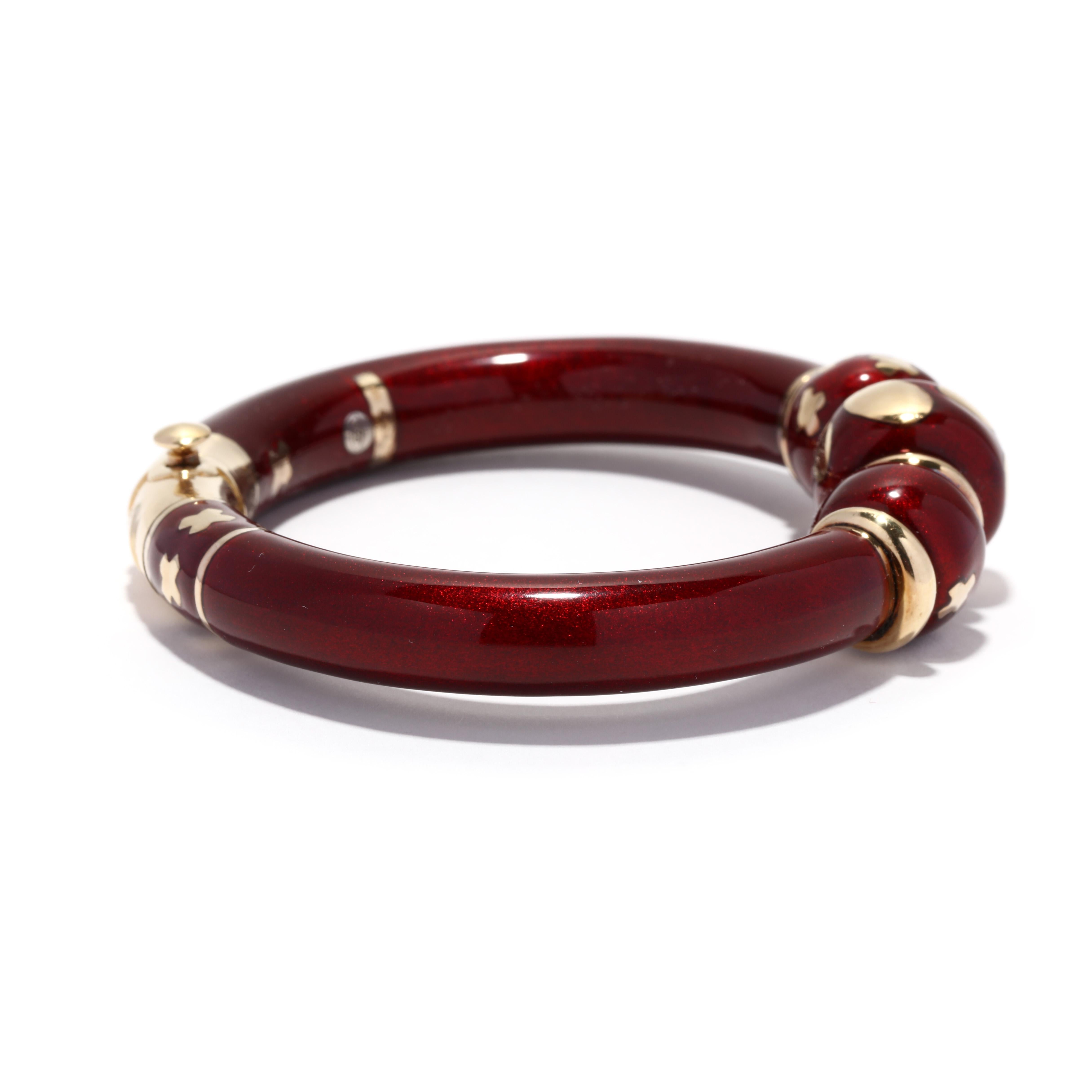 A vintage 18 karat yellow gold, sterling silver and red enamel bangle bracelet design by La Nouvelle Bague. This bracelet features thick bangle bracelet with red enamel and with alternating gold rondel beads and thick red enamel beads with X and O