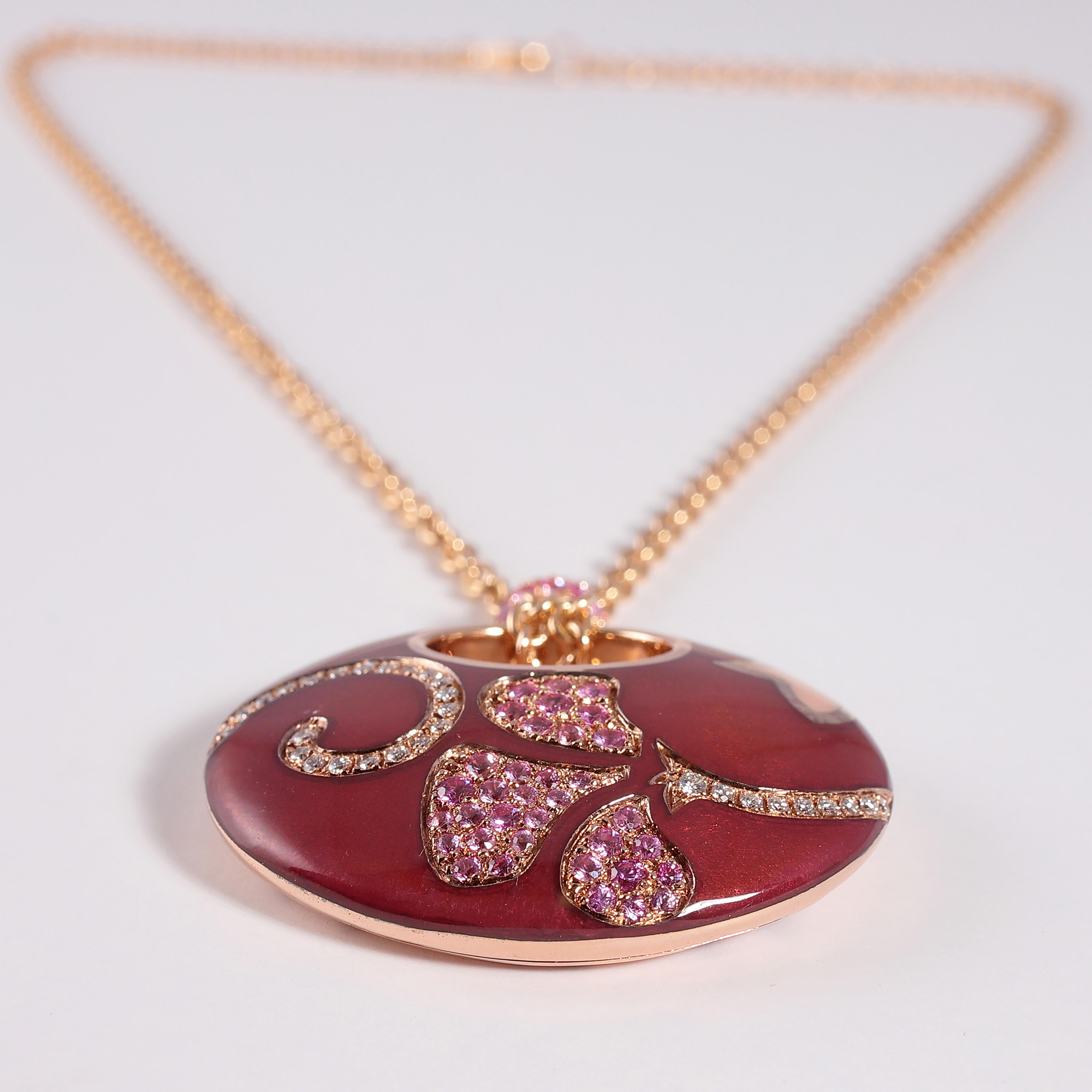 This beauty is from the Petali Collection by La Nouvelle Bague and features approximately 1.00 carat of pink sapphires and approximately 0.25 carats of diamonds.  The pendant measures 1 1/2 inches in width x 1 1/4 inches in length.