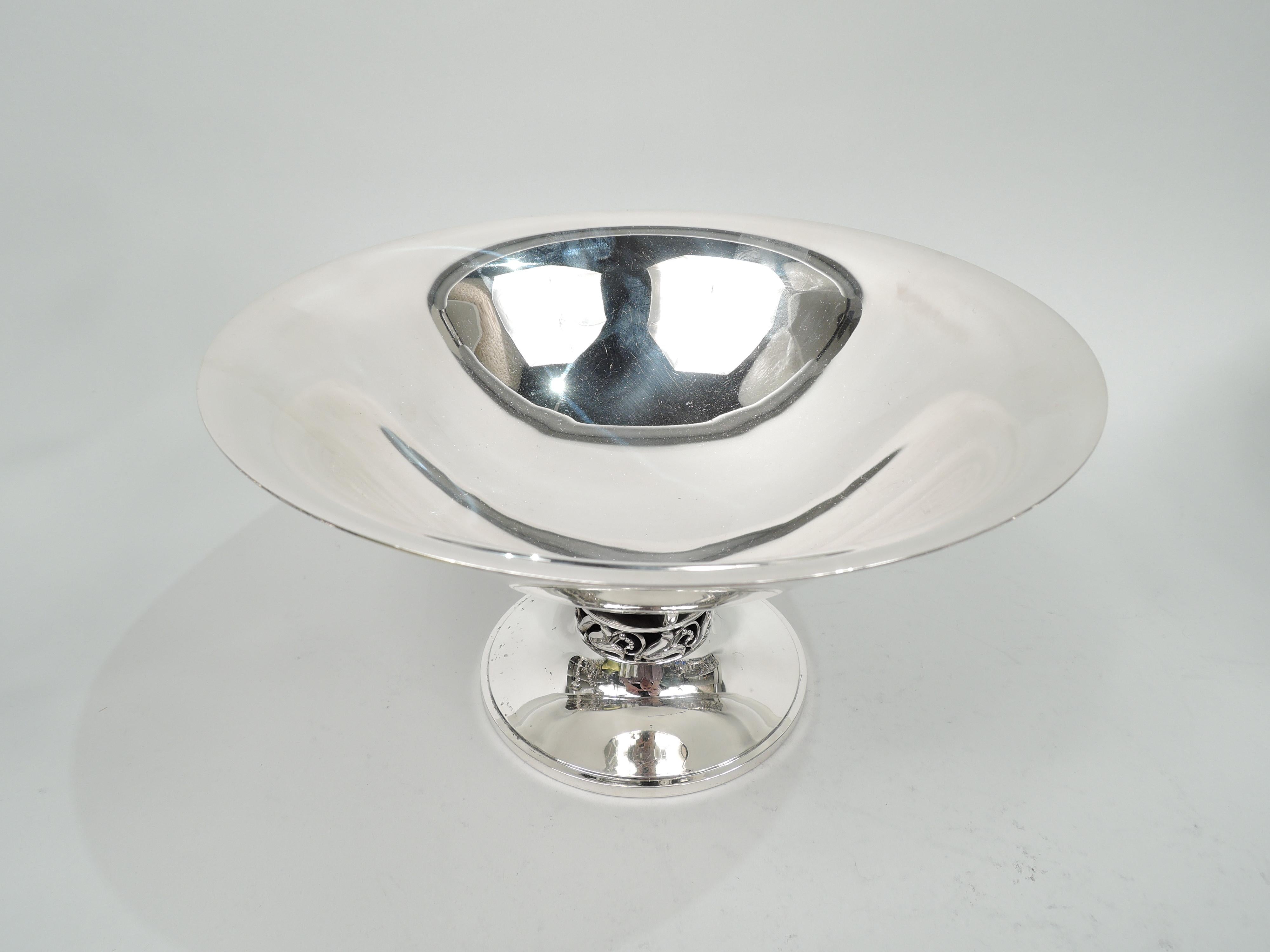 Mid-Century Modern sterling silver compote. Designed by Alphonse La Paglia (d. 1953) for International Silver Co. in Meriden, Conn. Bowl has wide mouth with flared rim and curved and tapering support. Short support comprising alternating rings and