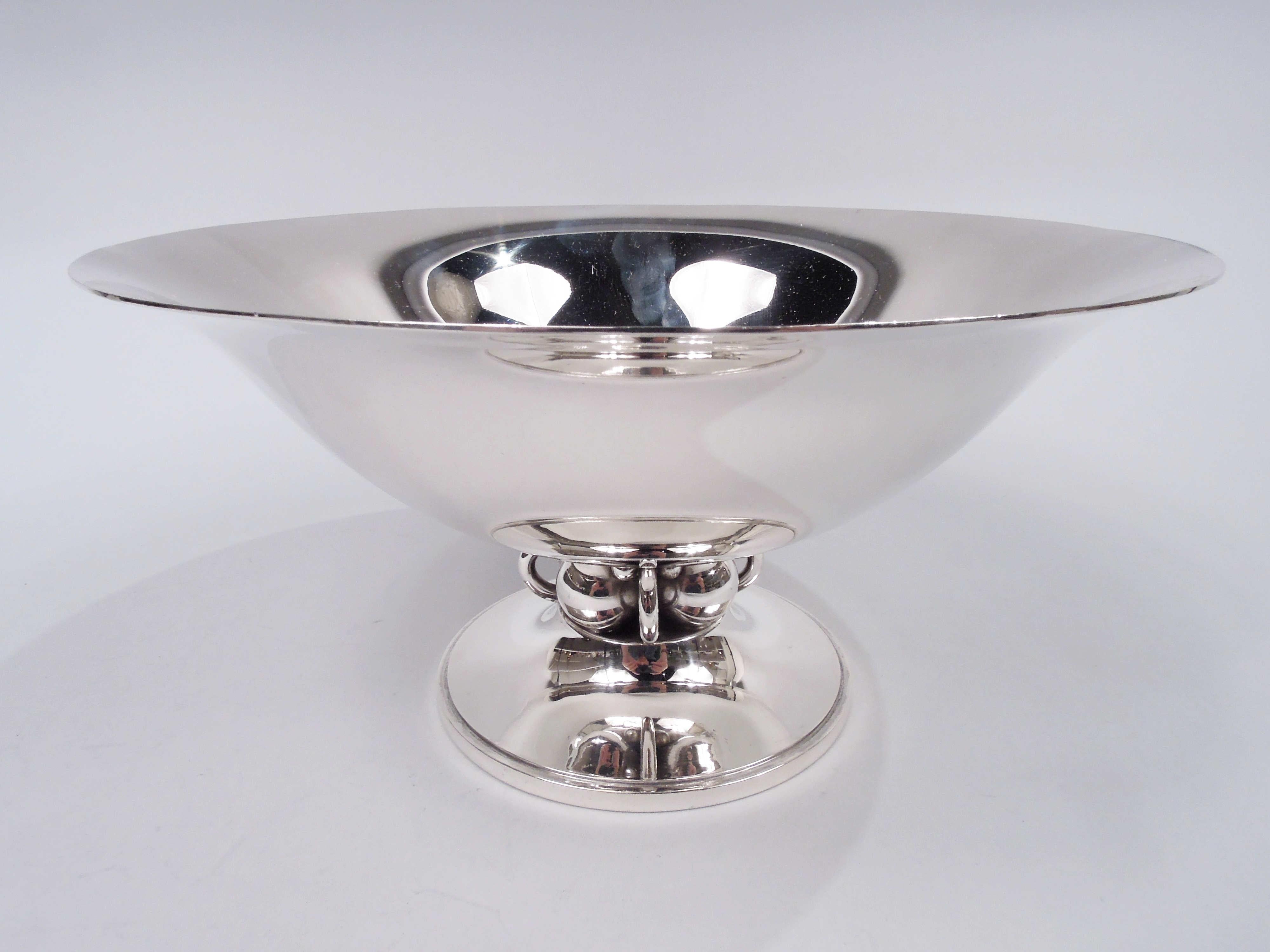 Midcentury Modern sterling silver centerpiece bowl. Made by Alphonse La Paglia (d. 1953) in New Jersey. Deep and tapering with flared rim. Raised foot with short support in the bead and ring arrangement that proved influential with other American