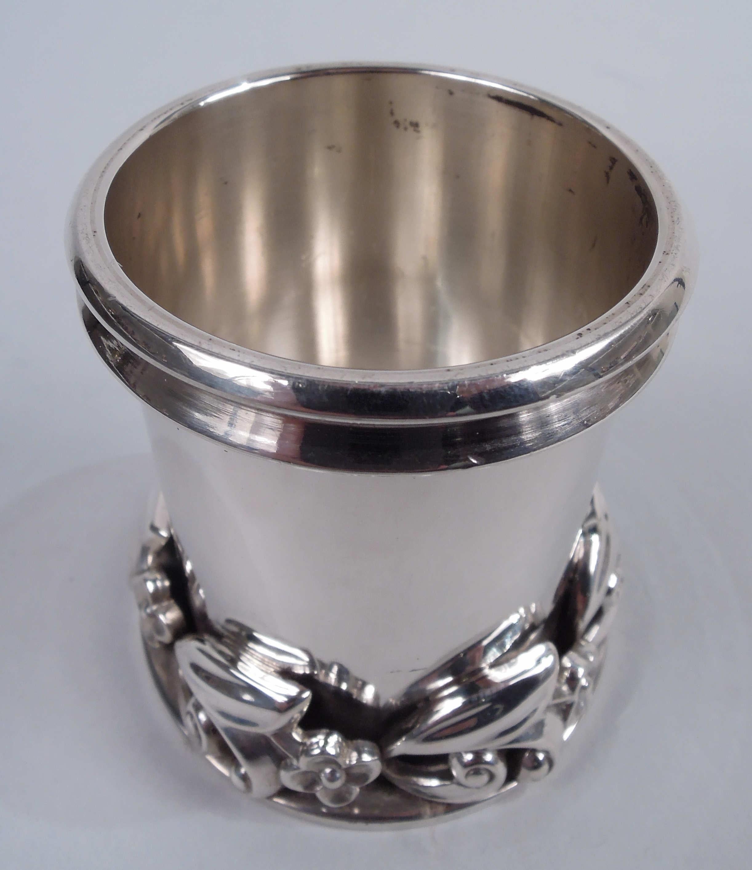Midcentury Modern sterling silver toothpick holder. Made by Alphonse La Paglia (d. 1953) in New Jersey. Drum-form with double-banded mouth rim. Spread base applied with cast band comprising alternating leafing scrolls and flowerheads. Fully marked