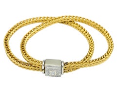 Pulsera de cadena tejida La Pepita con cierre de caja de diamantes en oro cepillado de 18 quilates