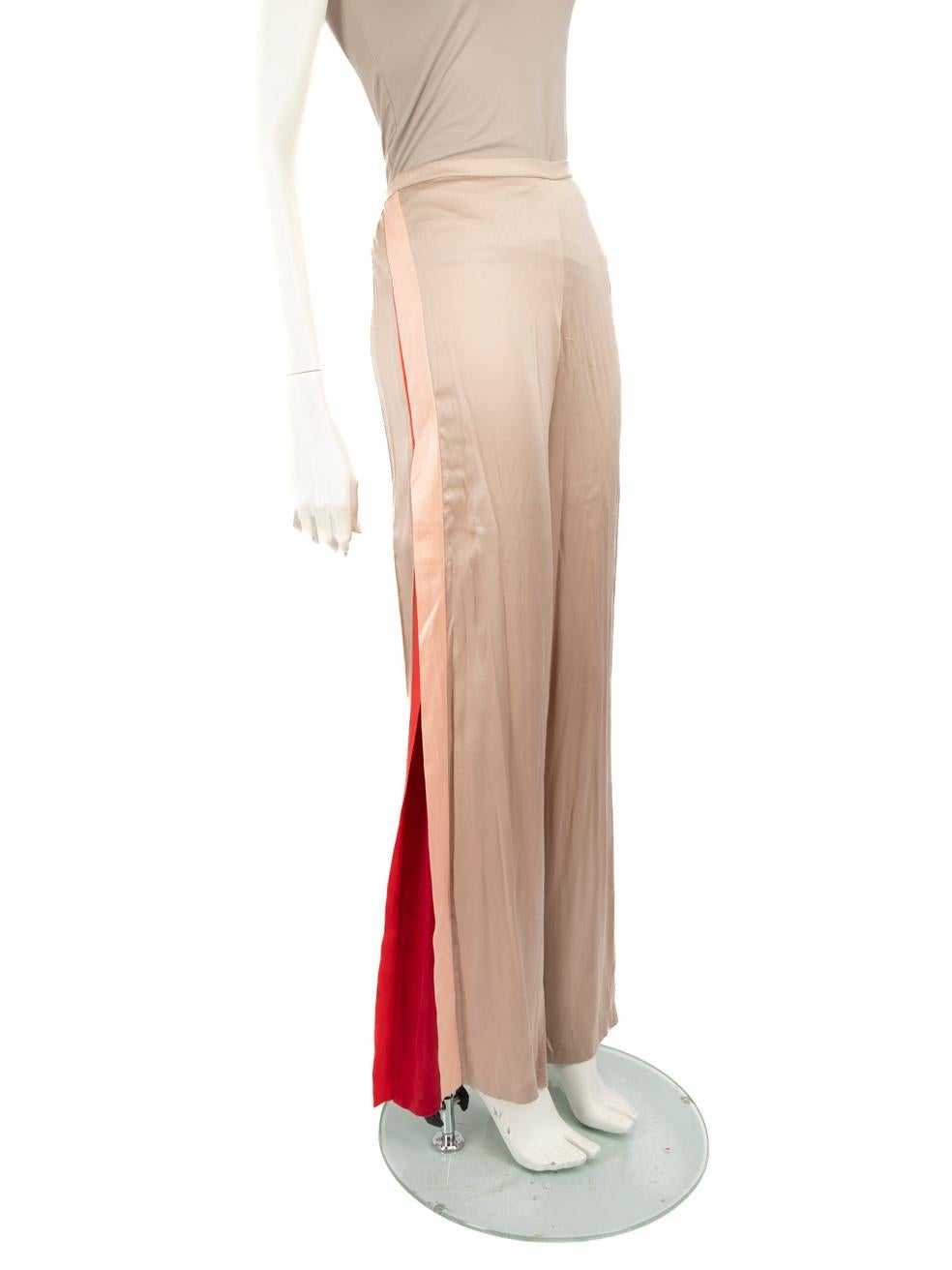 CONDITION is Good. General wear to trousers is evident. There are areas of plucks and pulls to the weave across the surface. There is a small brown marking on one leg on this used La Perla designer resale item. Missing composition label.
 
 
 
