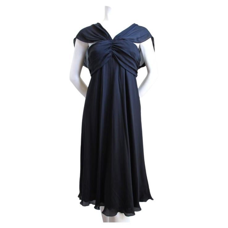 Dramatic, black silk chiffon dress with removable beaded rhinestone detail and ruching at neckline from La Perla dating to the early 2000's. Dress is labeled an Italian size 44 however it best fits an Italian 42 or US 4-6. Approximate length is 42
