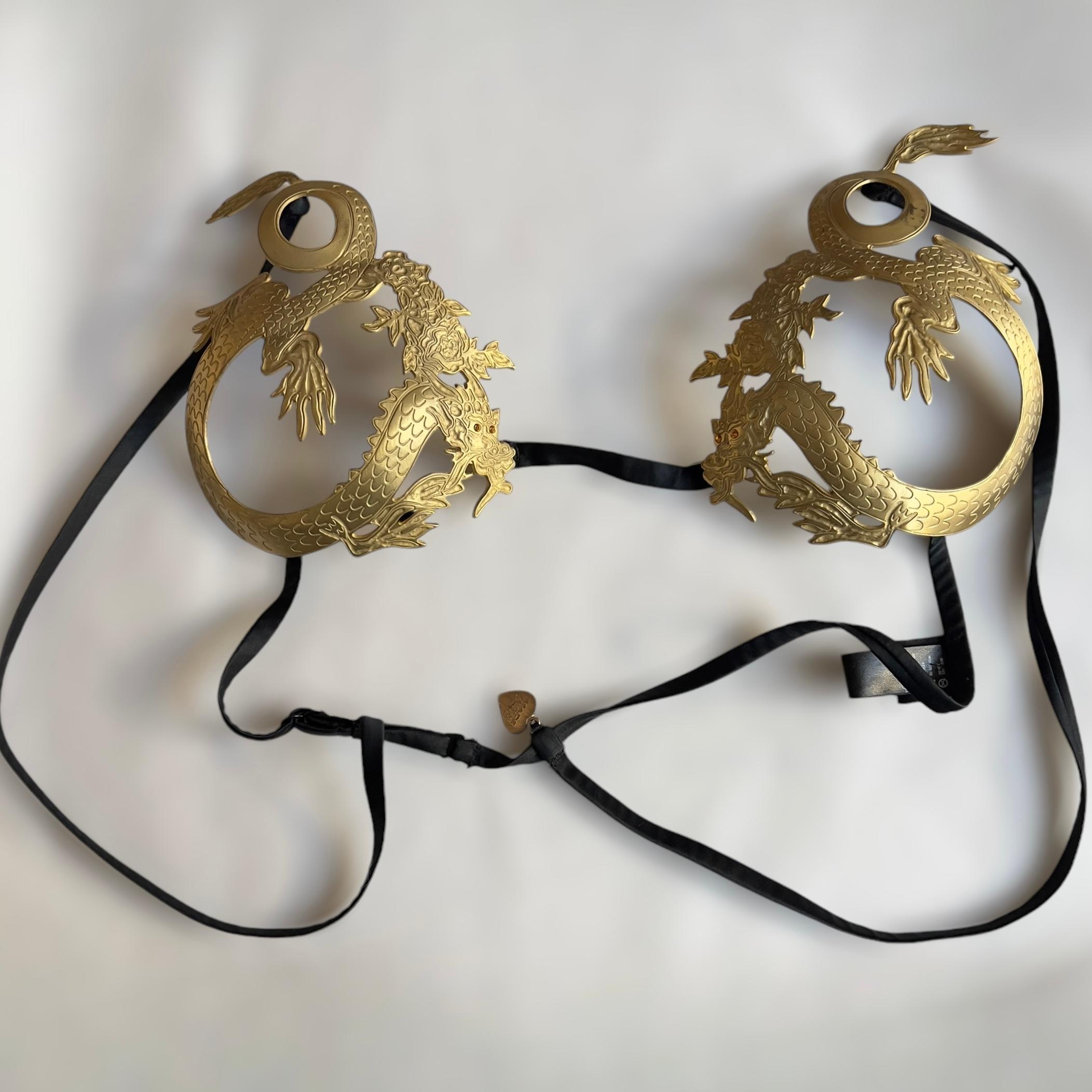 Designer Background: La Perla, synonymous with luxurious and innovative lingerie, is celebrated for its experimental designs that transcend traditional lingerie aesthetics. Circa 2007, the brand introduced unique statement pieces like this metal