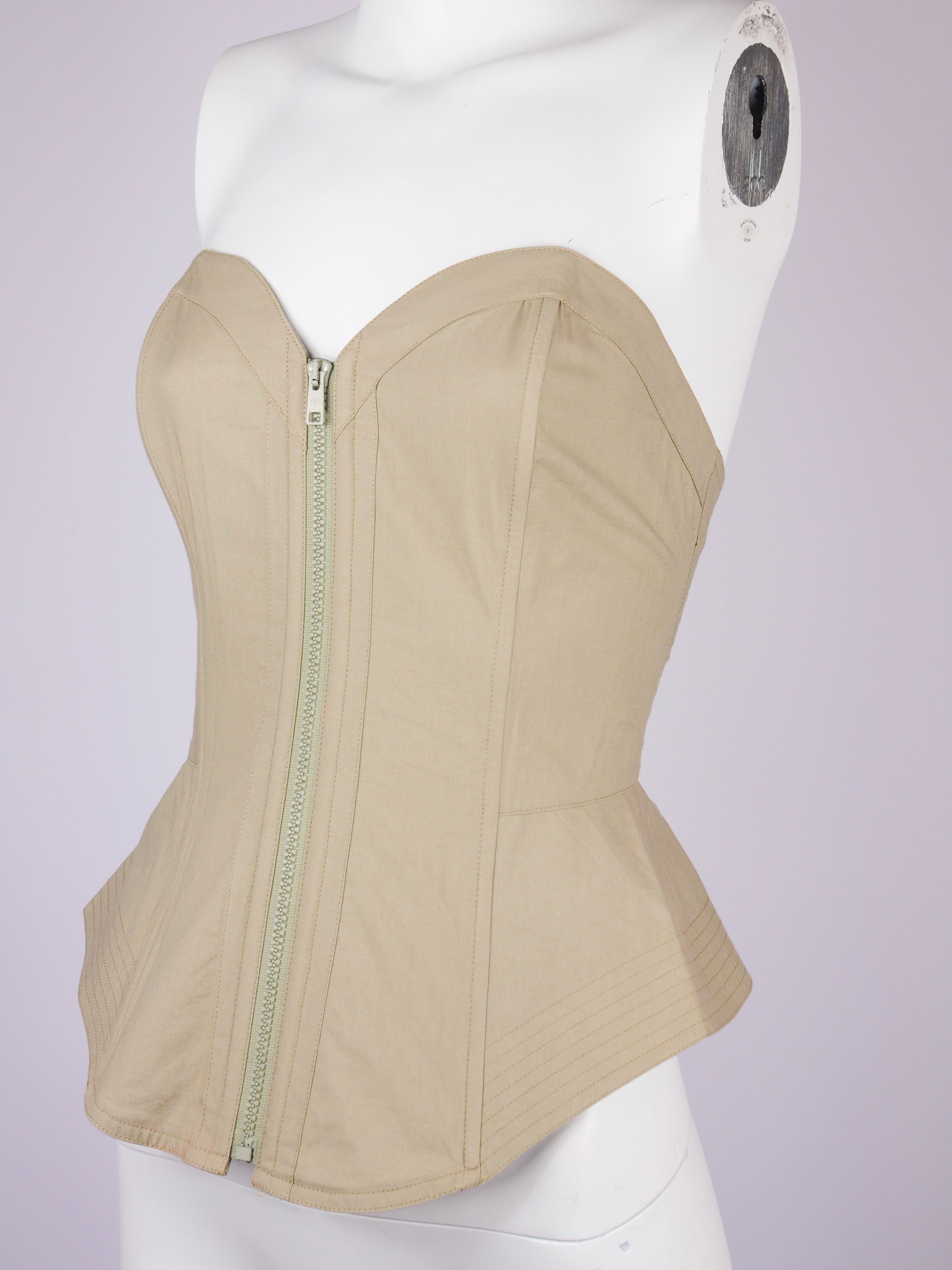 La Perla corset top in beige cotton from the early 1990s. This La Perla corset is deadstock, meaning it is new with tags and has never been worn before. It is reinforced with boning and features an elastic panel on the back to make it hug your body