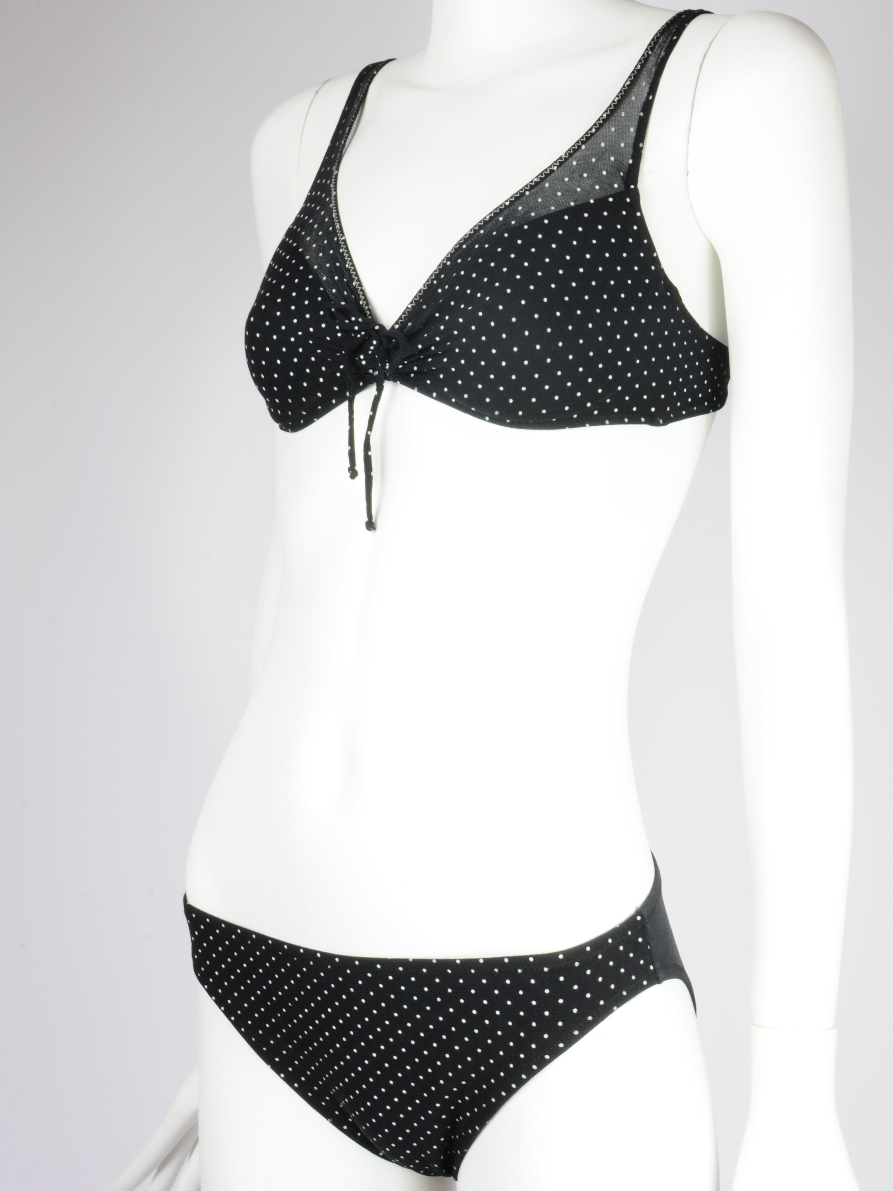 La Perla polkadot mesh bikini set from Malizia by La Perla from the 1990s. A soft mesh fabric with tiny polka dots printed on it. The mesh is solely sheer above the cups. The back of this La Perla bikini bottom is without mesh. The top features a