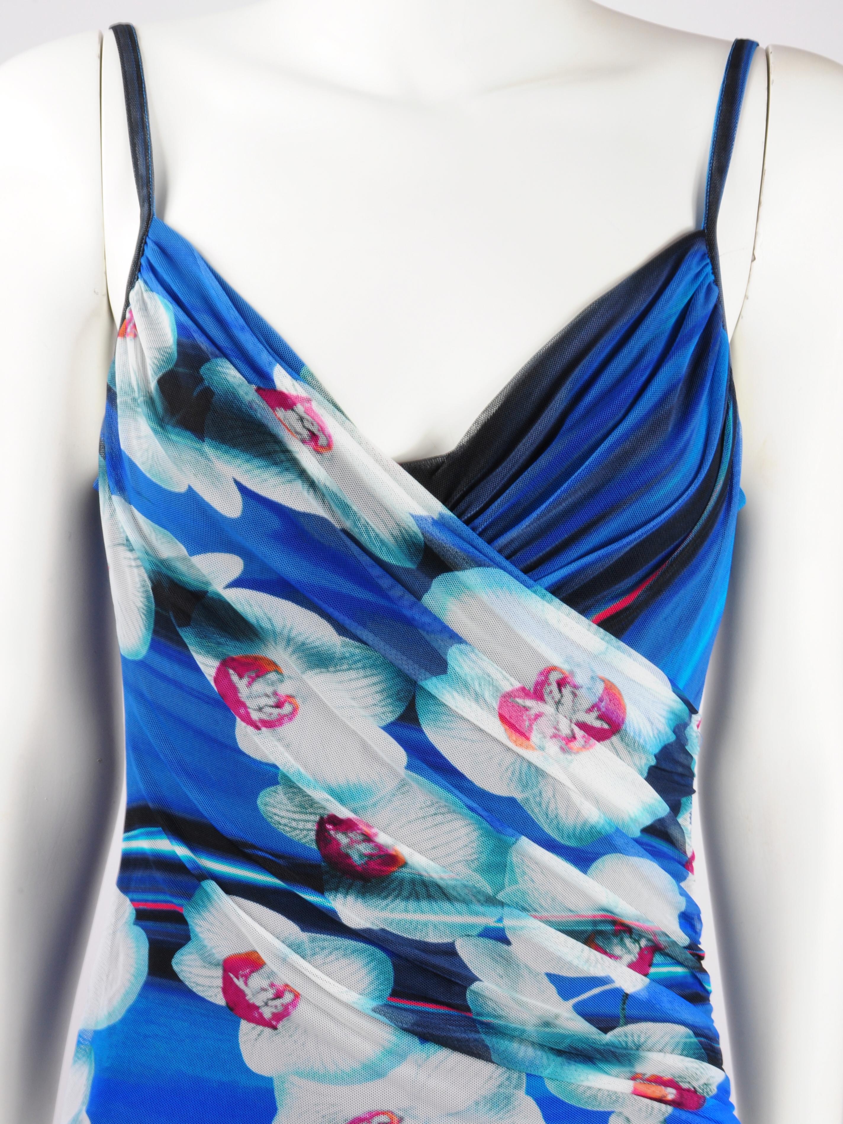 La Perla draped mesh onepiece swimsuit in blue with orchid flowers in a futuristic print.  This La Perla swimsuit features a floral print on one side of the draping with white and fuchsia pink orchids, and a kobalt blue striped print on the other
