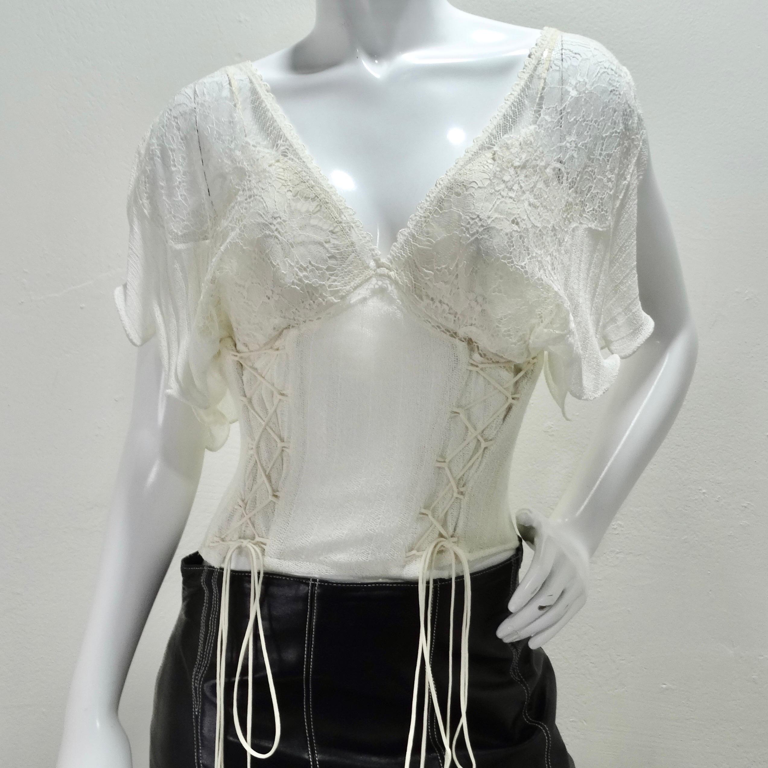 This vintage La Perla bustier is soo delicate and feminine! The perfect wearable bustier features a unique draped short sleeve which adds a playful touch. White rib knit cotton pairs beautifully white lace to create this timeless bustier top. A