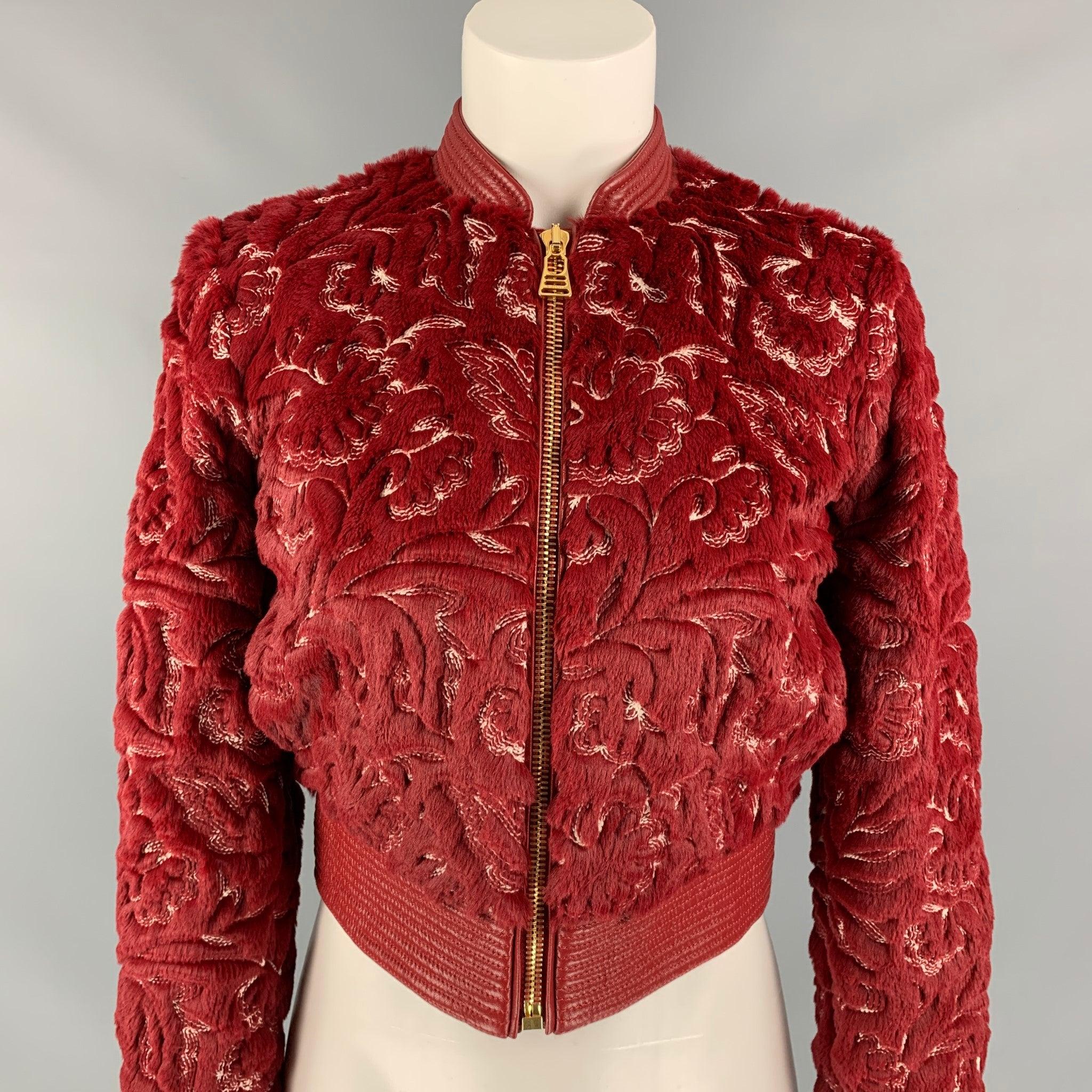 LA PERLA jacket comes in a red & white faux fur polyester / cotton with a full liner featuring a bomber style, leather trim, embroidered details throughout, slit pockets, and a gold toe zip up closure.
New With Tags.
 

Marked:   IT 36 / FR 32/ DE