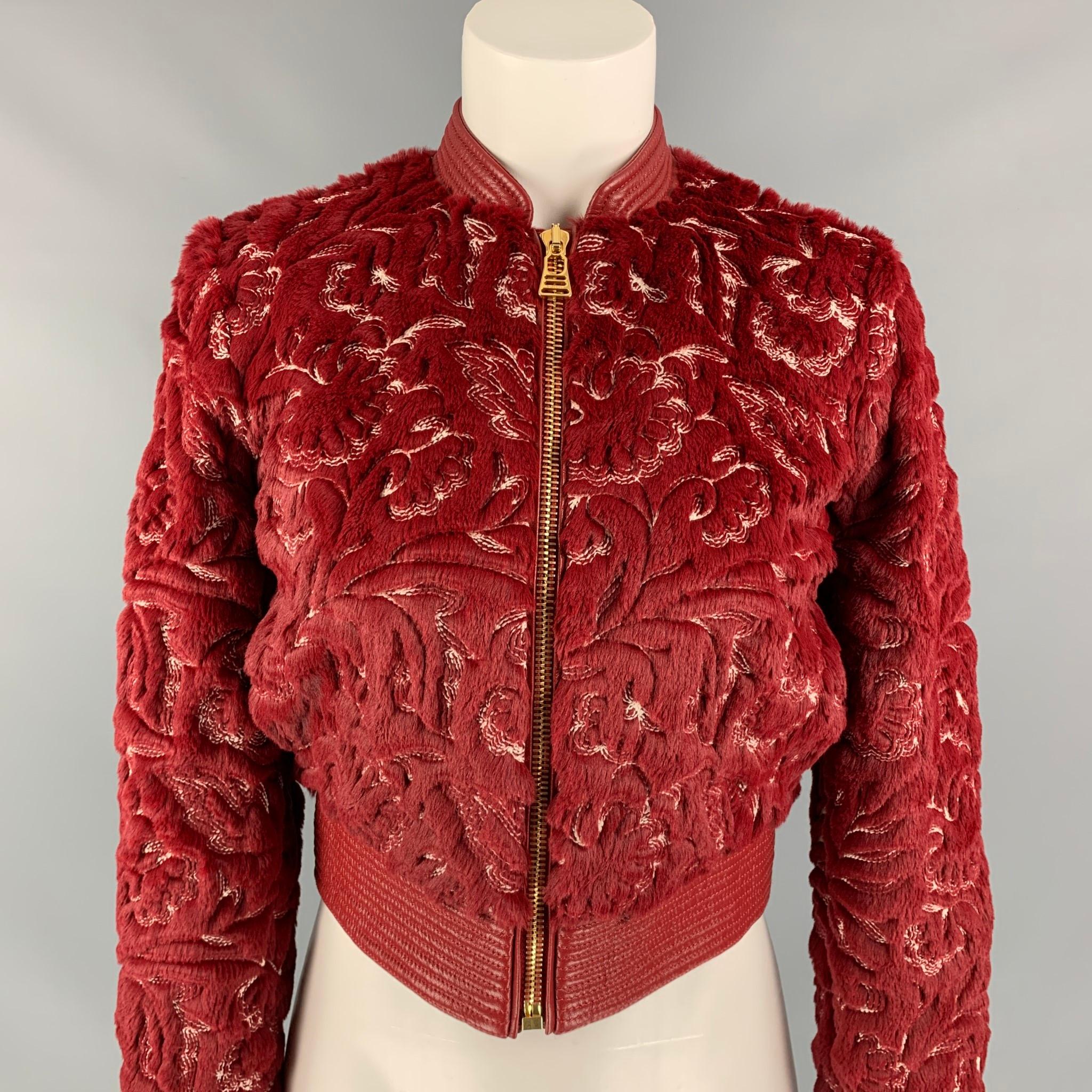 LA PERLA jacket comes in a red & white faux fur polyester / cotton with a full liner featuring a bomber style, leather trim, embroidered details throughout, slit pockets, and a gold toe zip up closure. 

New With Tags. 
Marked: IT 36 / FR 32/ DE 30
