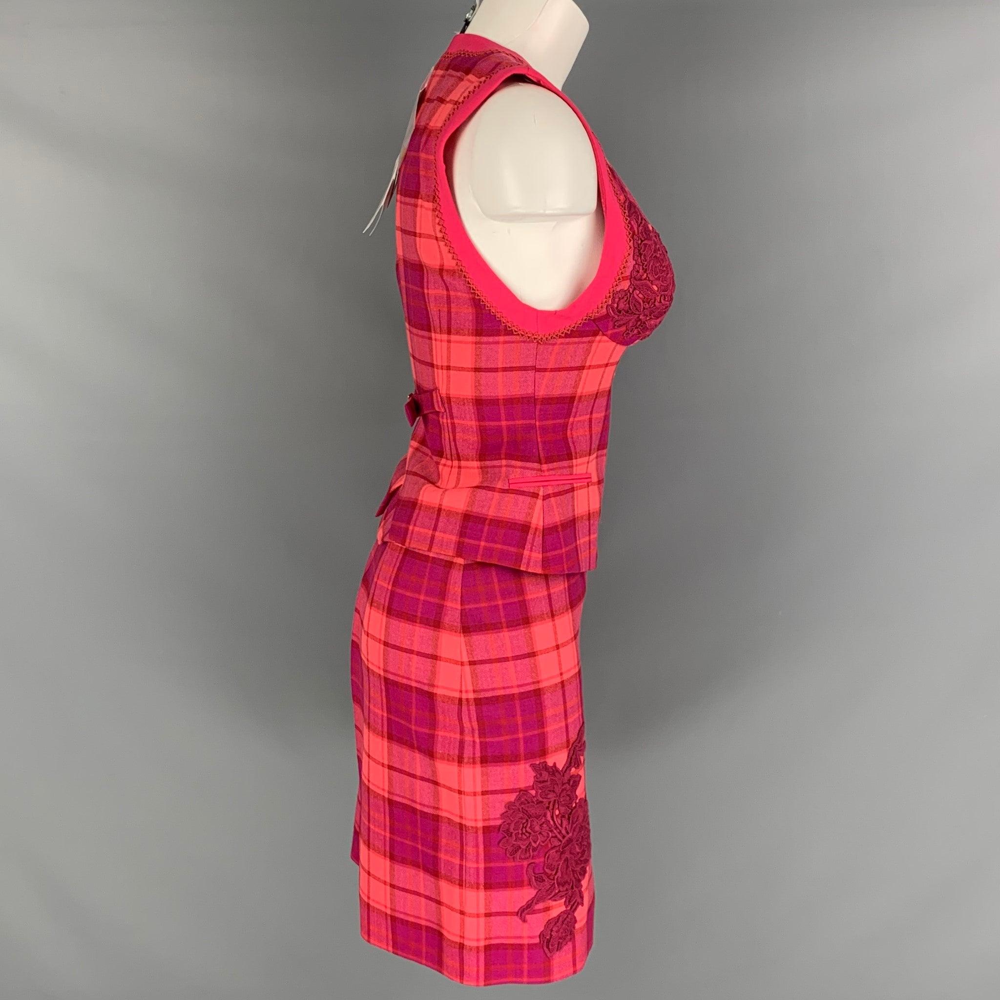 LA PERLA skirt set comes in pink and red plaid wool elastane woven material featuring a V-neck, single breasted vest with macrame details, appliques detail on bust, novelty buttons, and a matching above knee pencil skirt. New with Tags. 

Marked:  