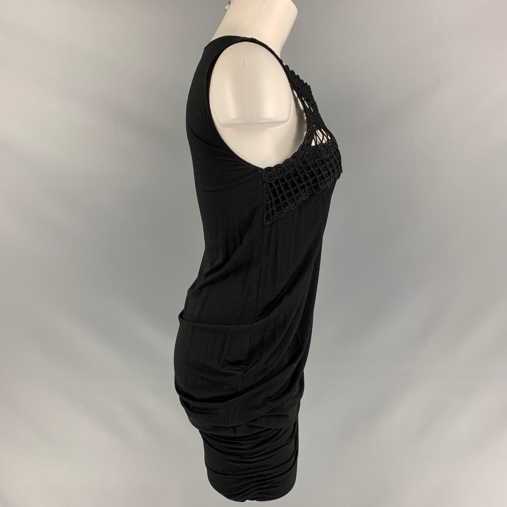 LA PERLA cocktail dress comes in a black rayon and spandex featuring a ruched bottom and crochet detail on the neckline. Made in Italy. 
Excellent Pre-Owned Condition. 

Marked:  42 

Measurements: 
 
Shoulder: 13 inBust: 33 inWaist: 36 inHip: 38