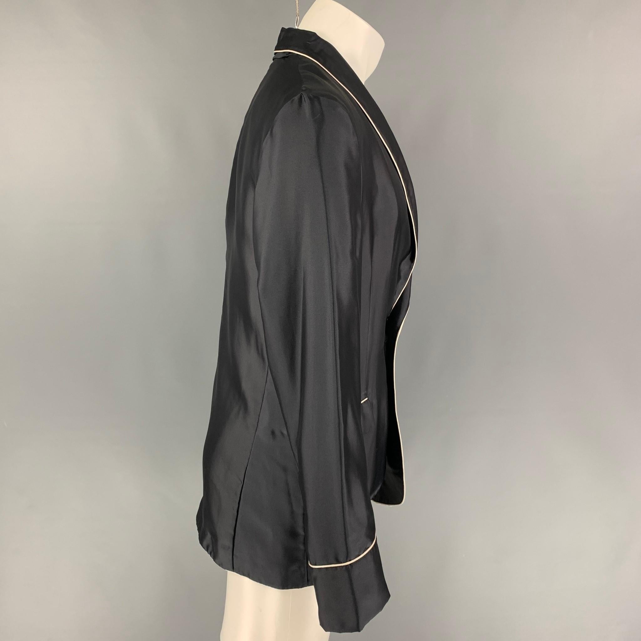 LA PERLA sport coat comes in a black & beige silk with a half liner featuring a shawl collar, flap pockets, and a double button closure. Made in Italy. 

New With Tags.
Marked: M

Measurements:

Shoulder: 17.5 in.
Chest: 40 in.
Sleeve: 26.5