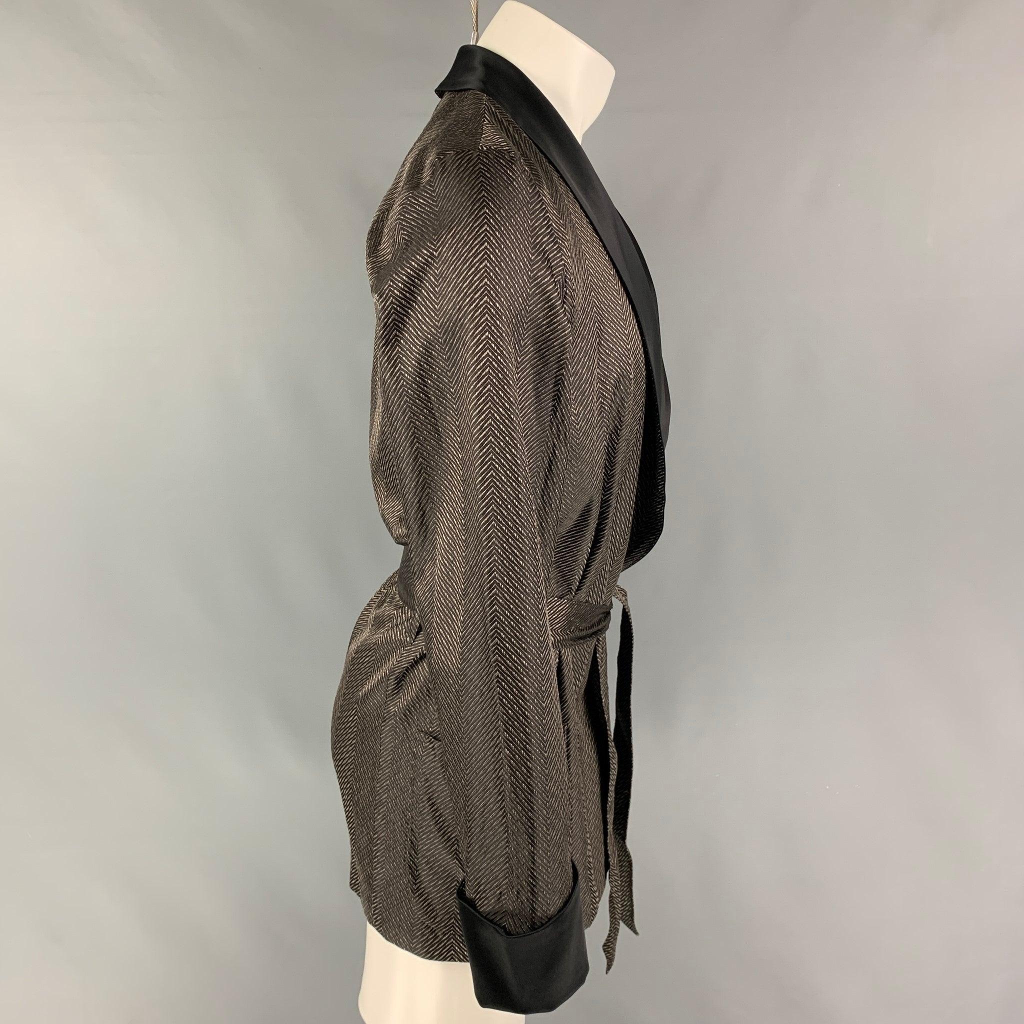 LA PERLA smoking jacket comes in a black & brown jacquard silk featuring a shawl collar, patch pockets, belted, and a open front. Made in Italy.
Very Good
Pre-Owned Condition. Fabric tag removed.  

Marked:   Size tag removed.  

Measurements: 
