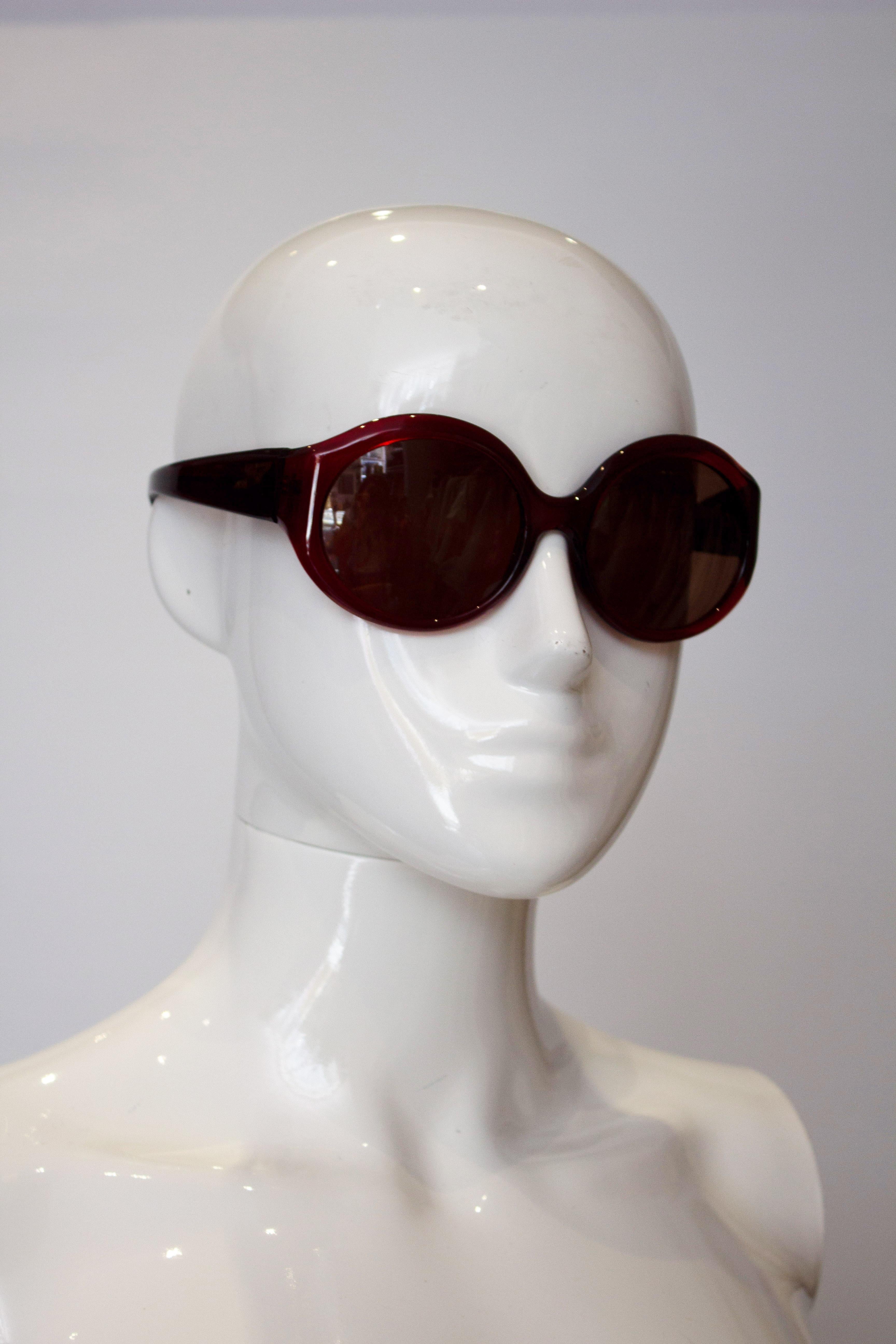 A stunning pair of La Perla sunglasses. The glasses are in a pretty burnt red colour, and model spec , 57 , col 954, height 2 1/2''.