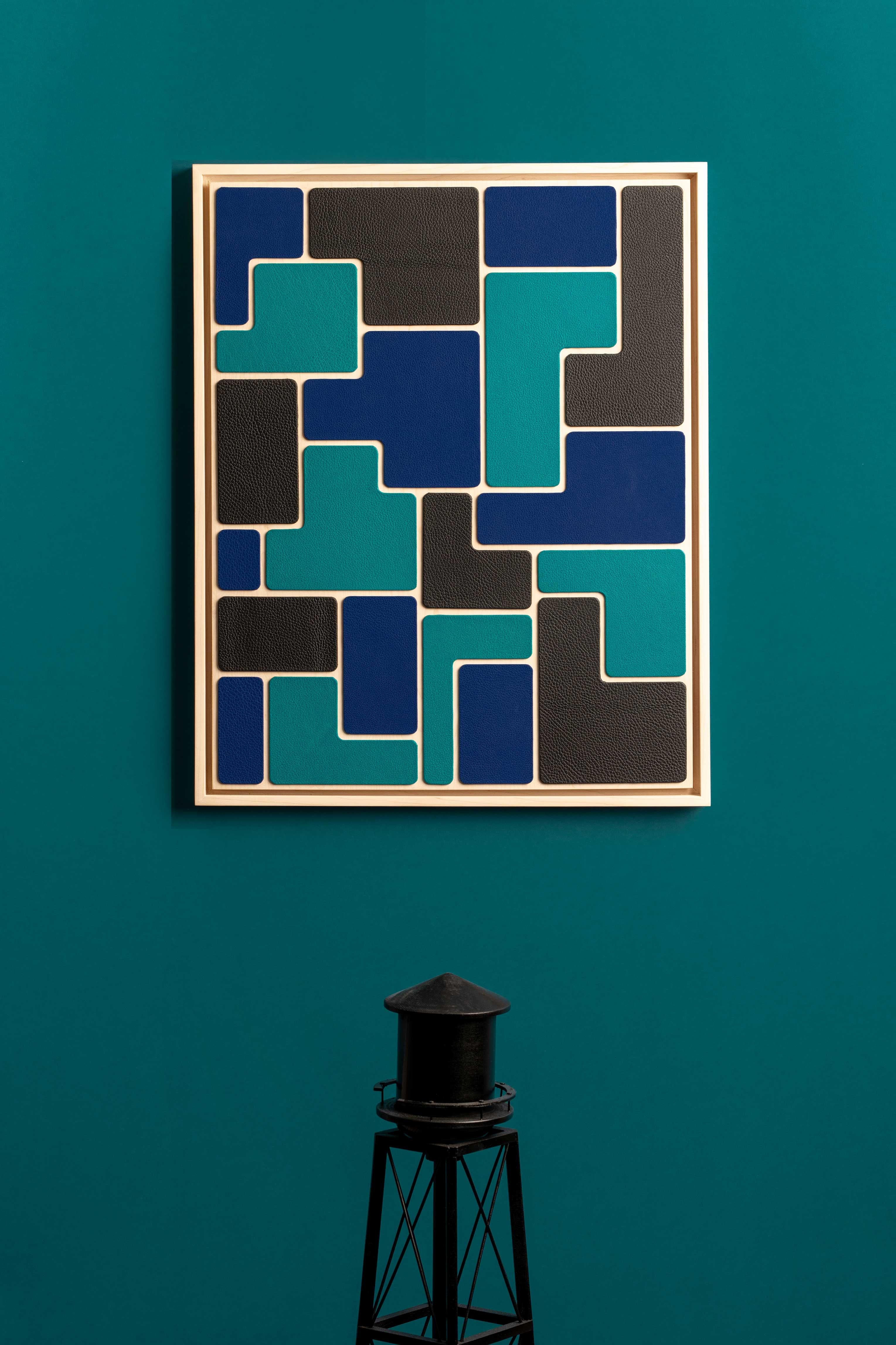 Leather wall art, made with relief, with a solid bleached maple wood frame.

This artwork combines our know-how, which is highlighted in this creation that blends art and craftsmanship. 

Composed of turquoise blue, bright blue and deep black