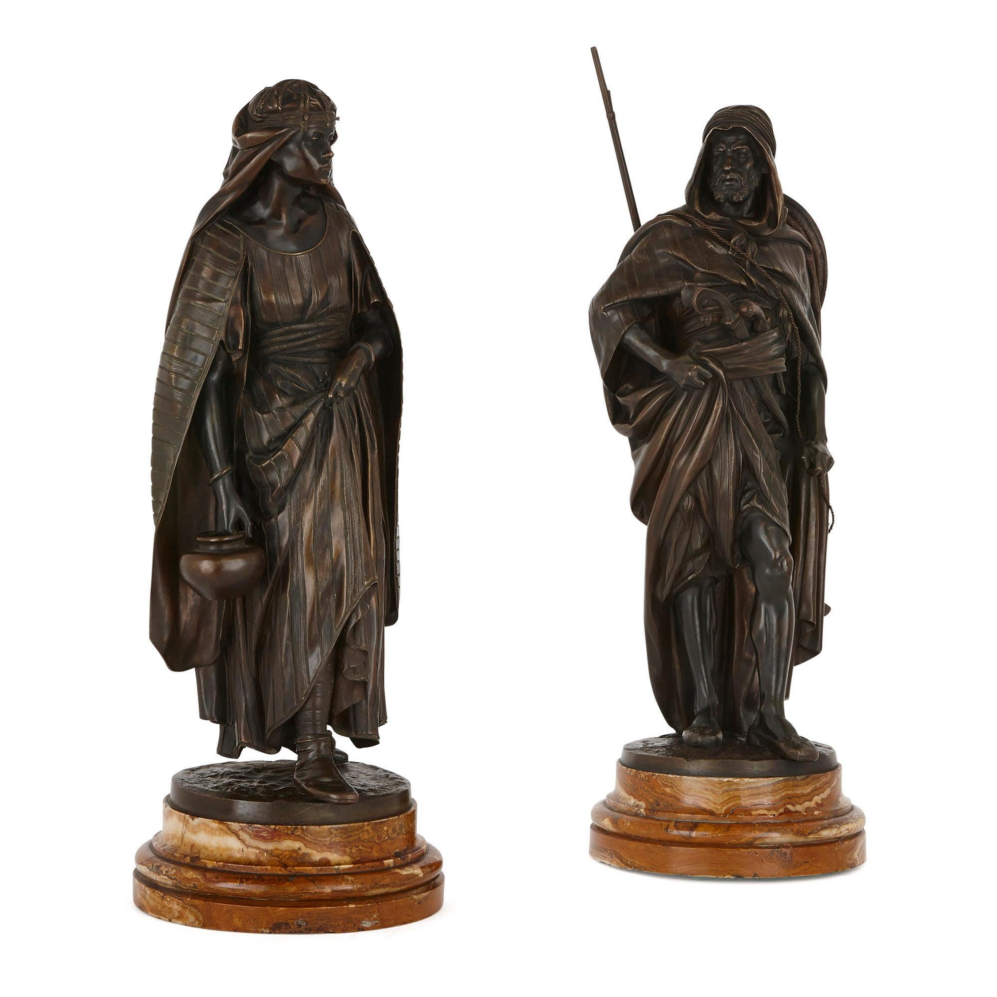 These wonderful patinated bronze sculptures were created in France in the 19th Century when Orientalist art was in fashion. They are the work of the prestigious sculptor, Jean Jules Salmson (French, 1823-1902). Titled ‘La Porteuse’ and ‘Le Guerrier