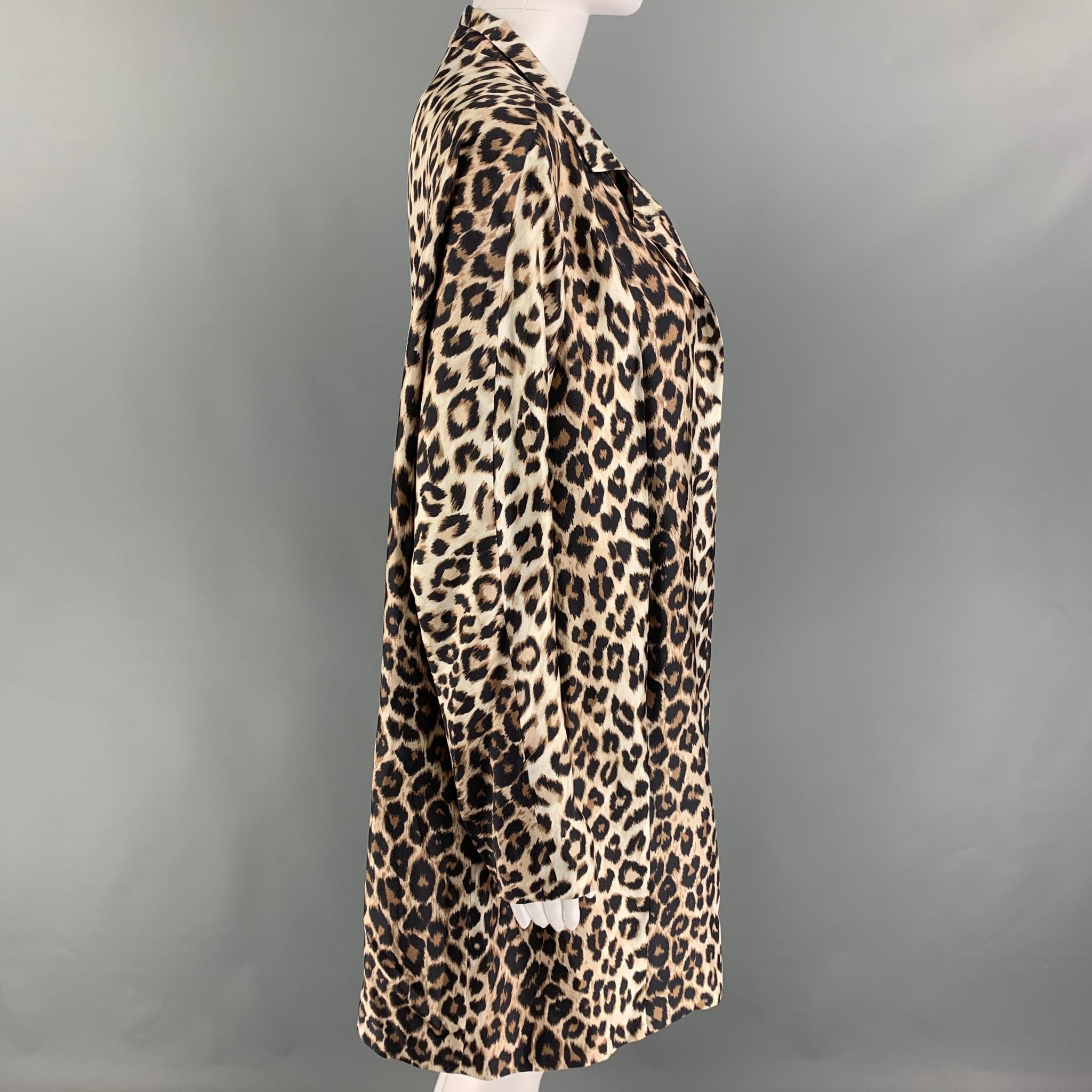 LA PRESTIC OUISTON coat comes in a beige & brown animal print silk featuring a notch lapel, slit pockets, and a open front. 

Excellent Pre-Owned Condition.
Marked: 1
Original Retail Price: $1,380.00

Measurements:

Shoulder: 16 in.
Bust: 40