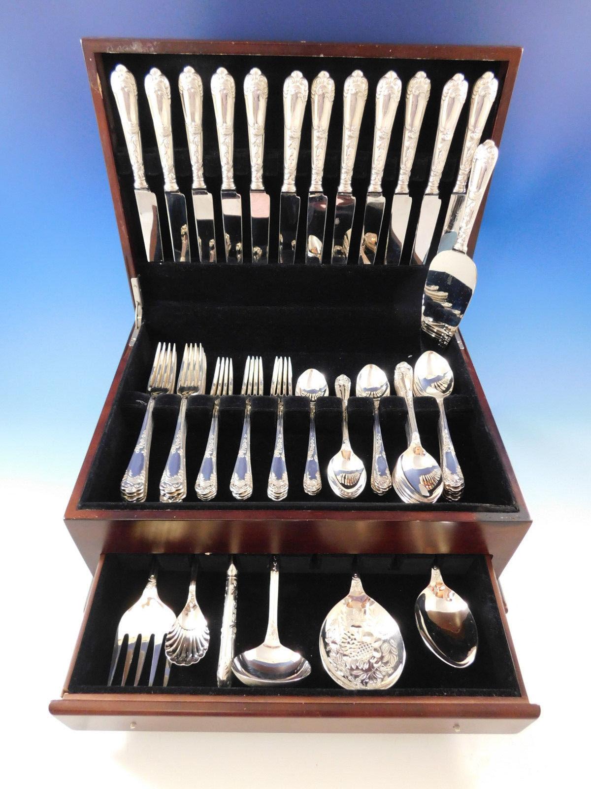 Superb dinner size La Regence by Carrs England sterling silver flatware set, 67 pieces. This is Carrs best known Art Nouveau pattern, a rich design with a honeysuckle and leaf decoration. This set includes:

12 dinner size knives, 9 5/8