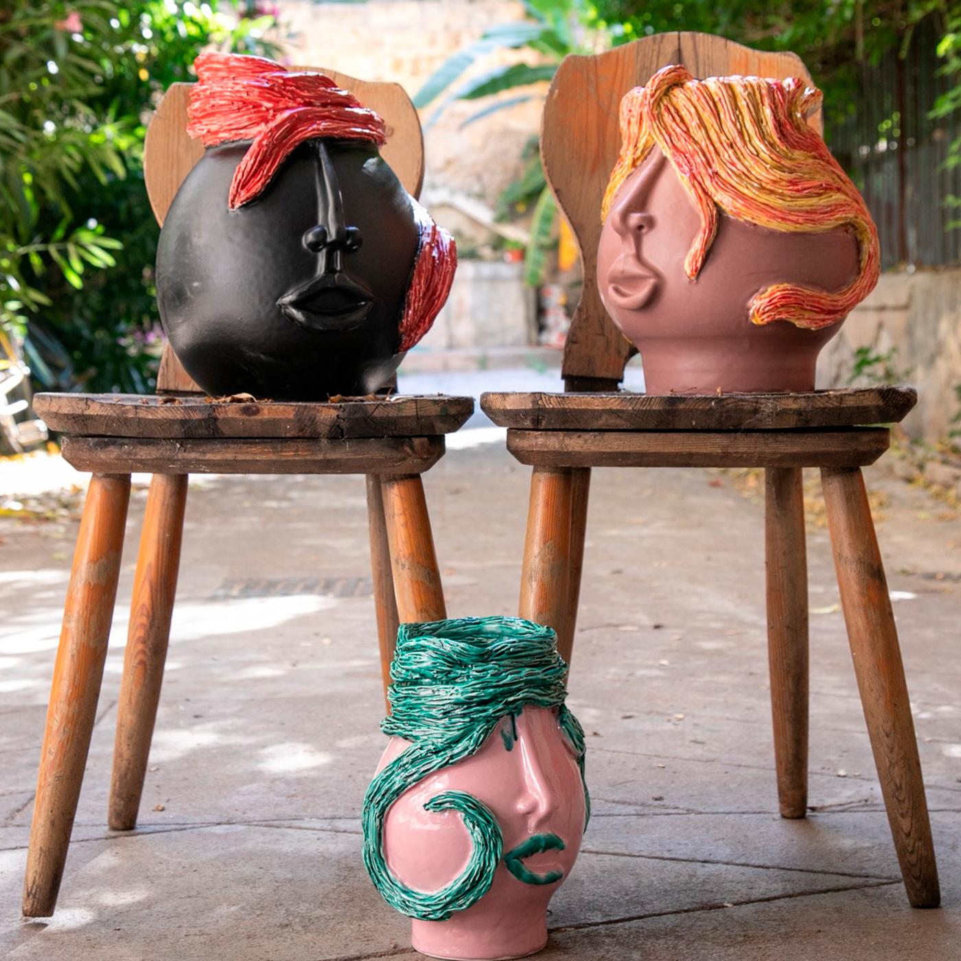 A splendid contemporary take on traditional Moor's heads, this superb sculpture by Patrizia Italianocan be used as a decorative objet d'art as well as a flower vase for it can harmlessly contain water. Deftly handcrafted of ceramic, enhanced with a