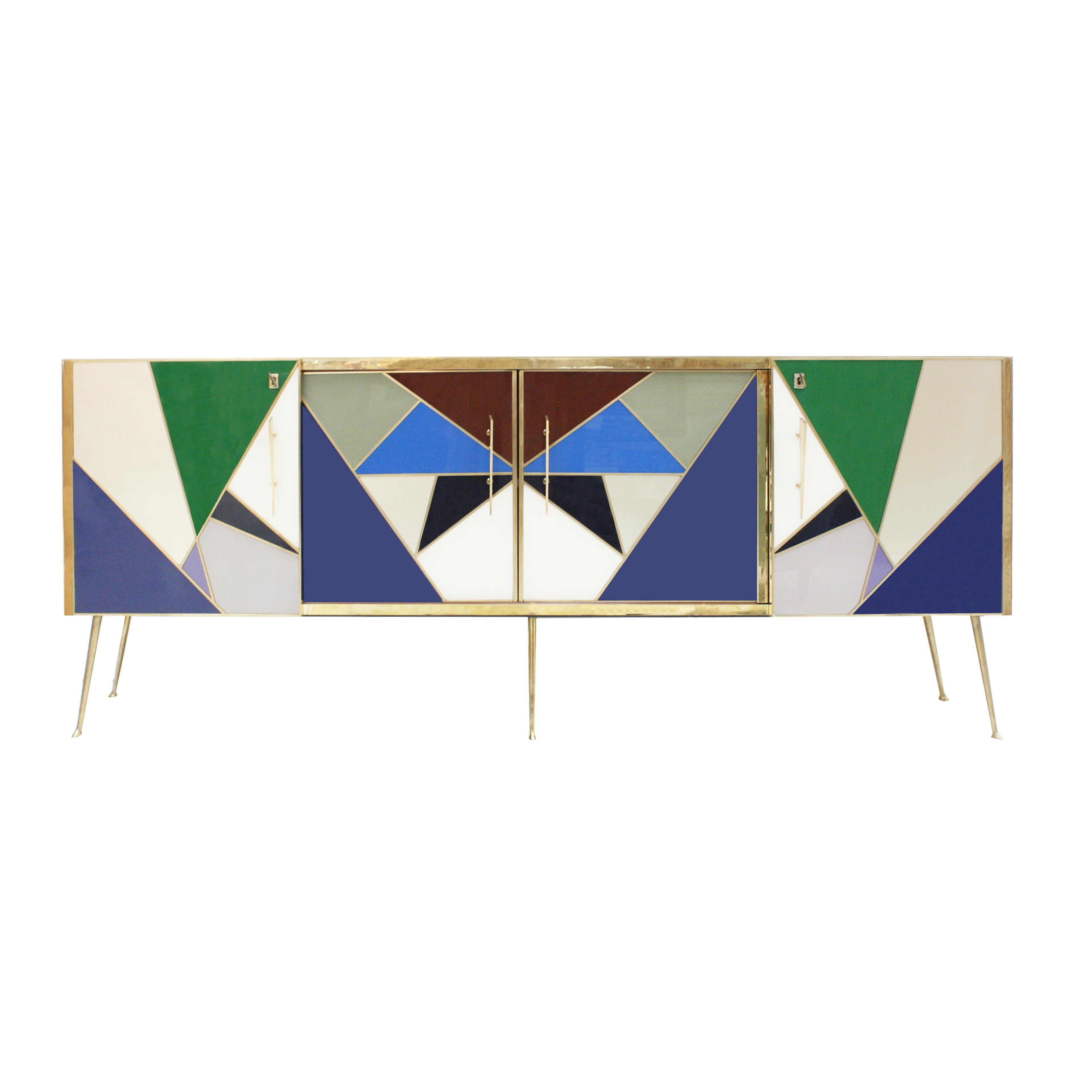 Italian sideboard designed by L.A. Studio. Composed of two central sliding doors and two folding doors on the sides. Made of solid wood structure, covered in colored glass. Brass profiles, handles and base. Made in Italy.

 
 
