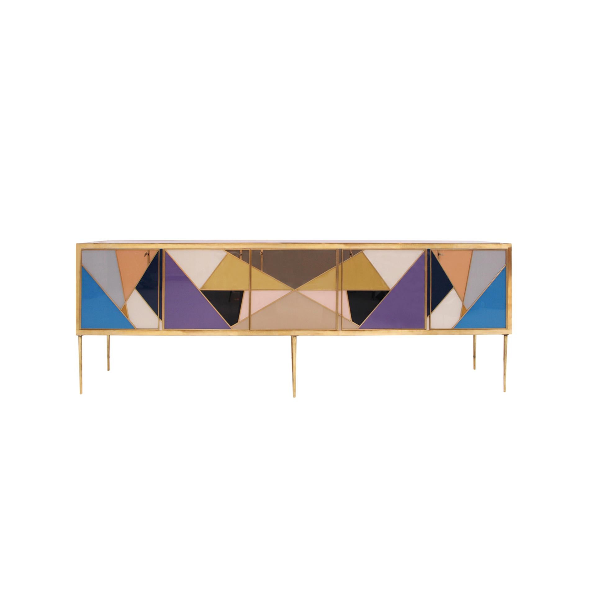 Sideboard with five doors made with an original solid wood structure from the 50s, covered in colored glass and profiles, handles and feet in brass. Produced in Italy.

Production time between 5 and 6 weeks.

Our main target is customer