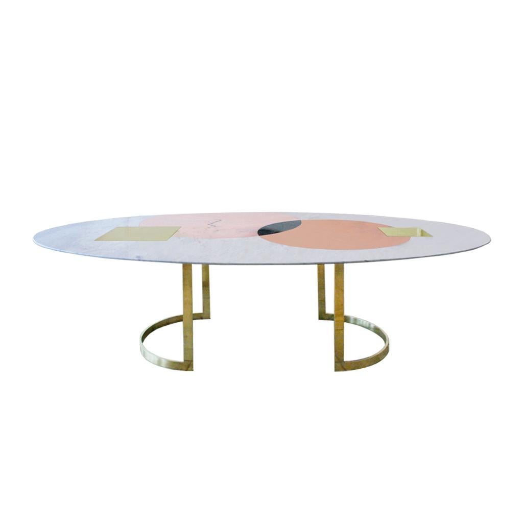 Contemporary dining table designed by L.A. Studio composed of two sculptural bases made of steel designed by Vittorio Introioni for Saporiti and stunning top made of different special marbles and brass details. Italian production.
This item is