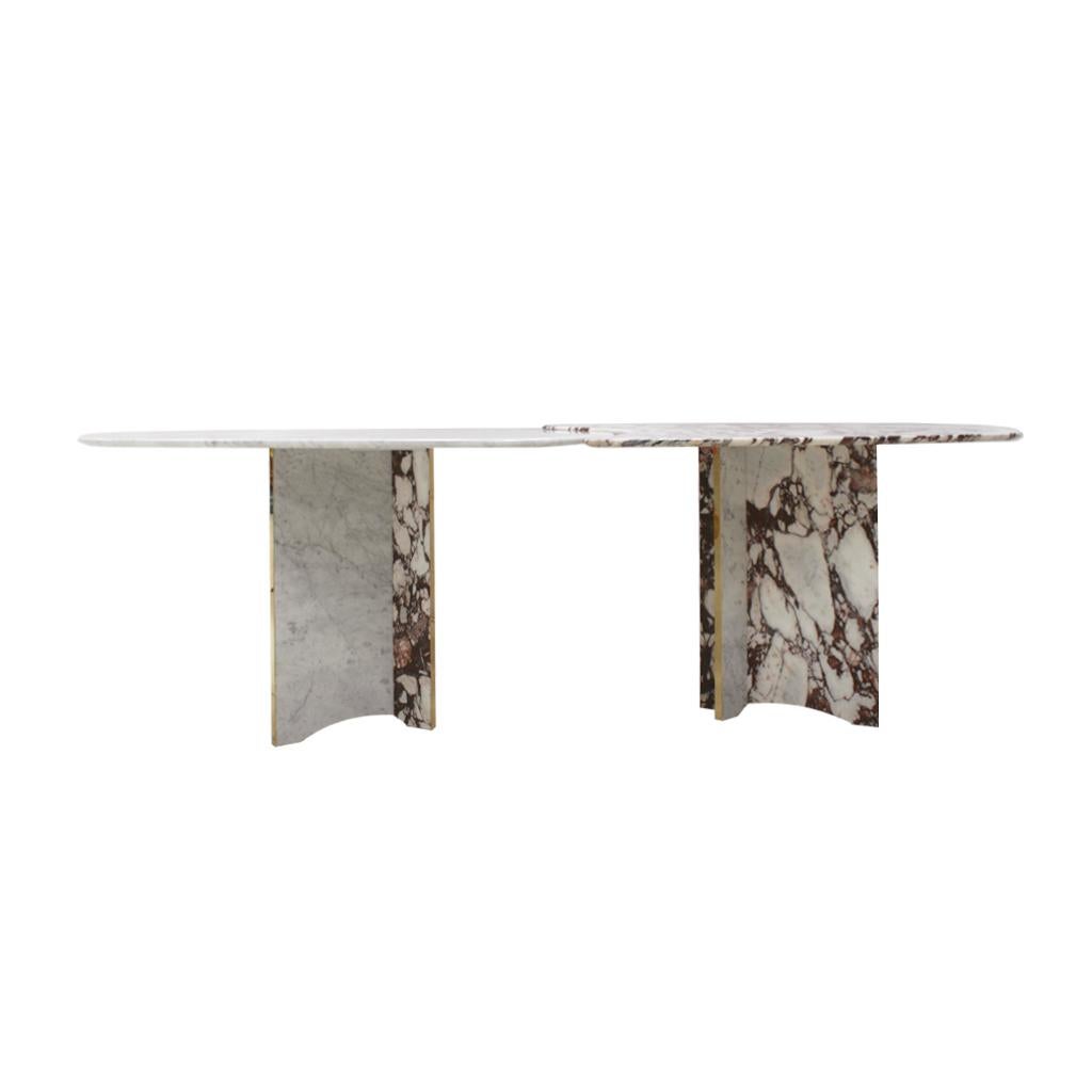 Dining table composed of two sculptural pieces of pink and white arabescato marble with brass details. This stunning table can be converted into a one composed table or in two separate pieces. Manufactured in Italy.

Our main target is customer