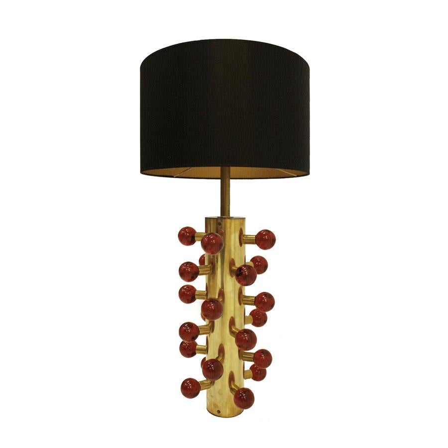Stunning pair of table lamps designed by L.A. Studio. Structure made of brass with red Murano glass spherical pieces.