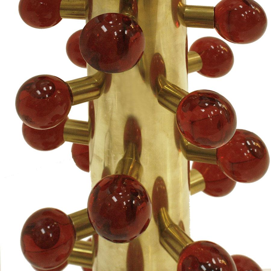Stunning table lamps designed by L.A. Studio. Structure made of brass with red Murano glass spherical pieces.