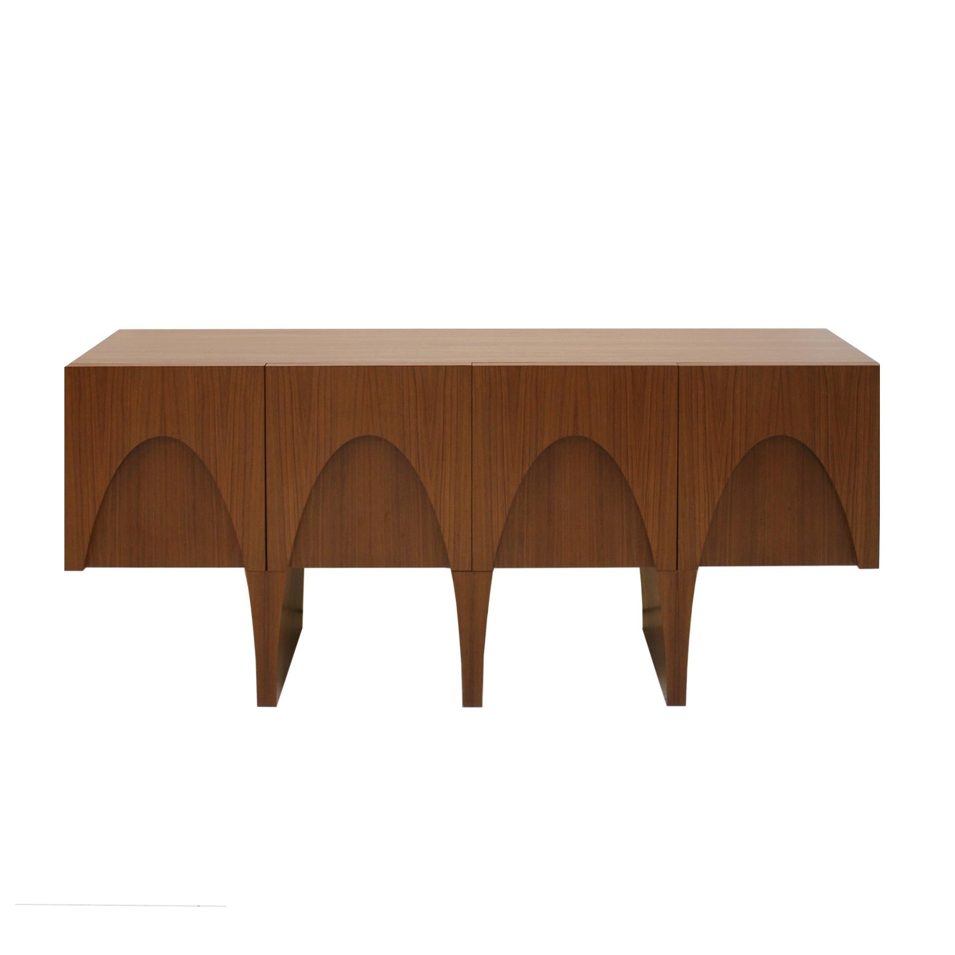 Wooden contemporary sideboard designed by L.A. Studio made of teak wood and interior in lemongrass wood. Composed of three sculptural legs and four folding doors.