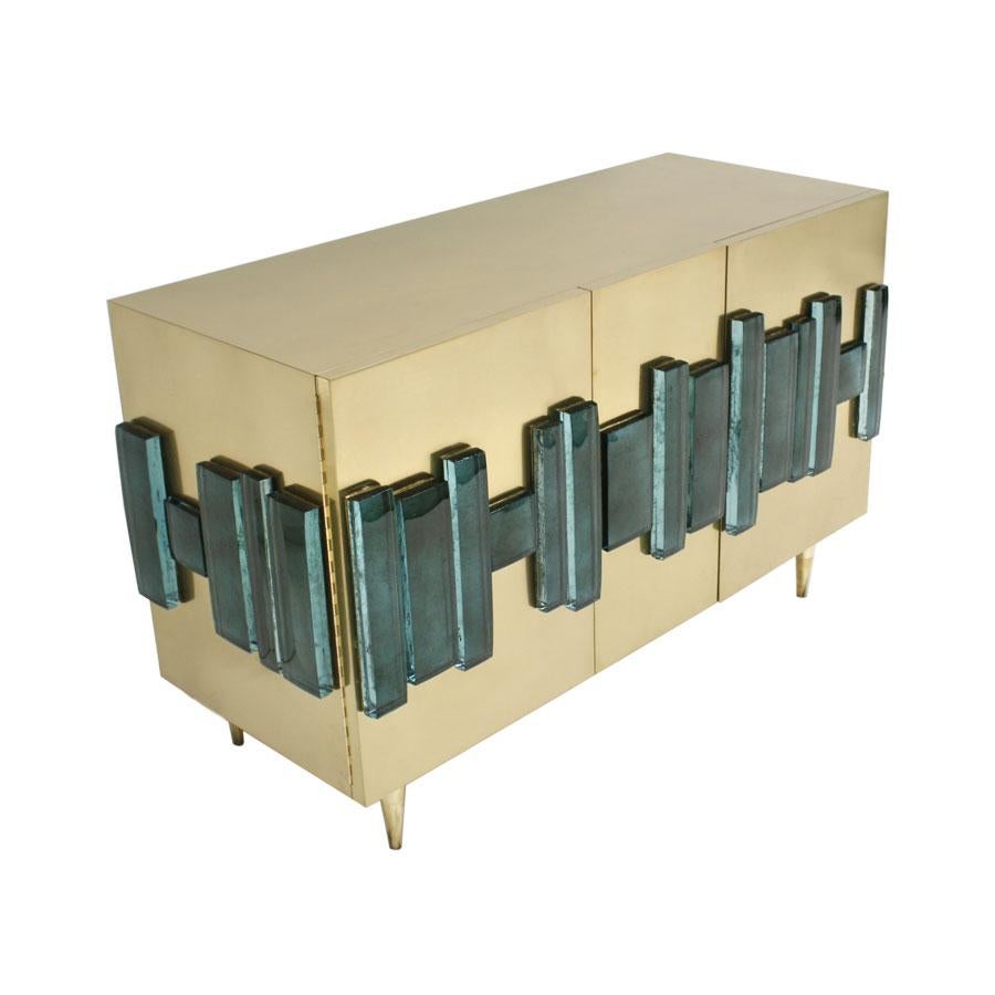 Sideboard with two doors with structure made of wood covered with brass and green Murano glass.