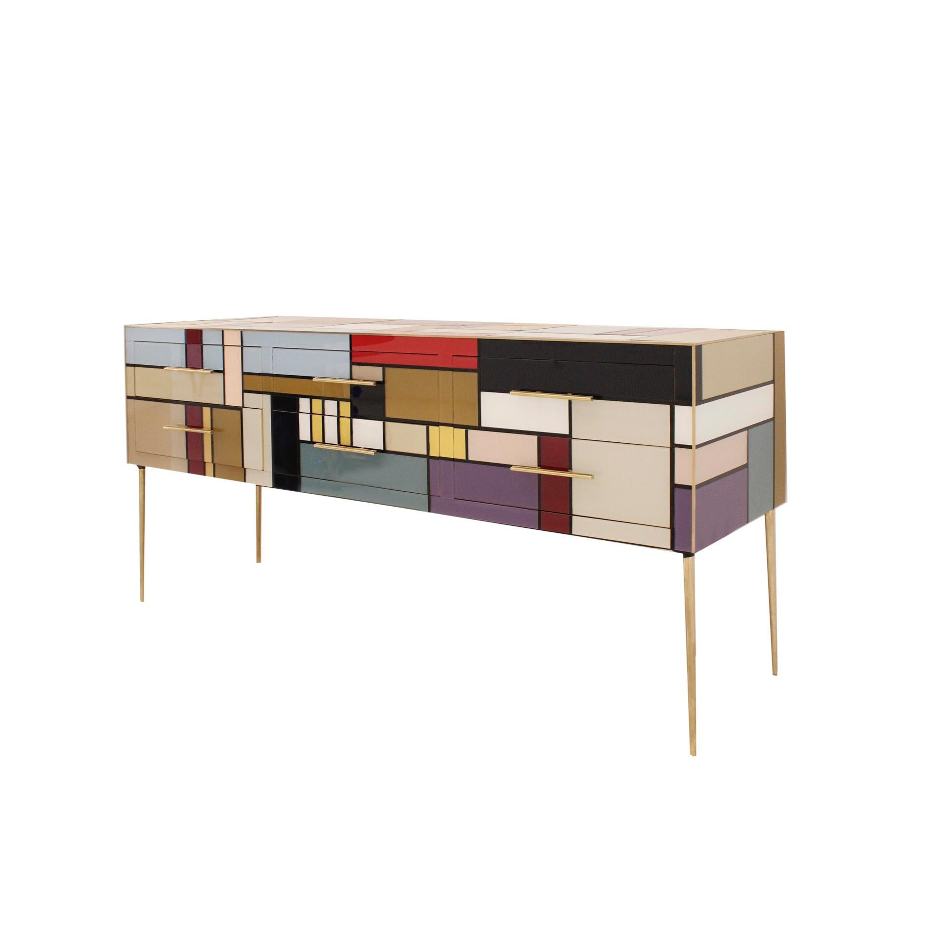 Italian sideboard with original structure from 50s. Composed of six drawers and six legs, with wooden structure covered in colored Murano glass, profiles, handles and feet in brass. Italian manufacture.

Take into account that the colors on the