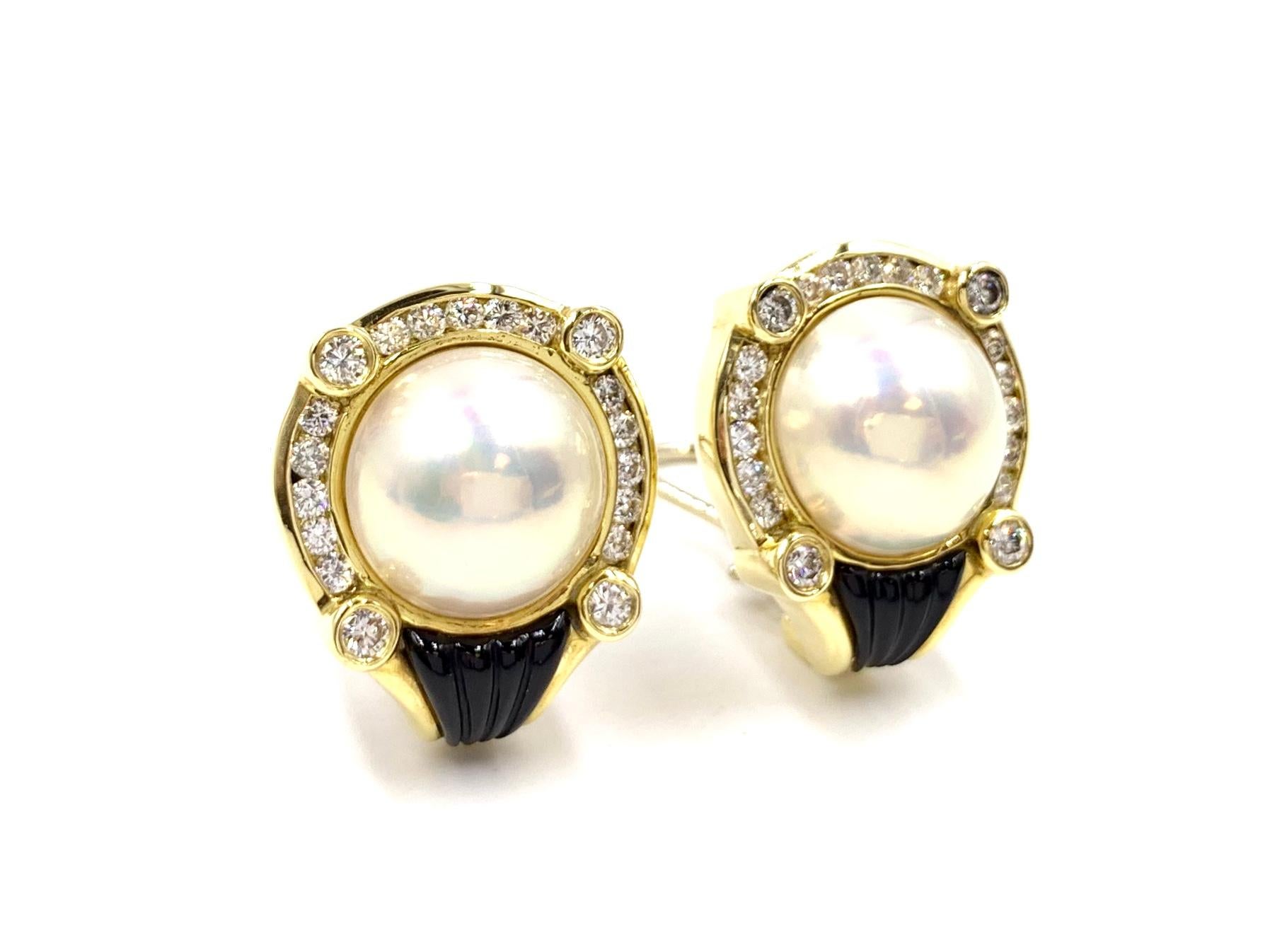 High quality 18 karat yellow gold button style earrings featuring a lustrous mabe pearl, bright white diamonds and fluted black onyx, crafted by La Triomphe. 38 round brilliant diamonds have a total weight of 1.46 carats at approximately F color,