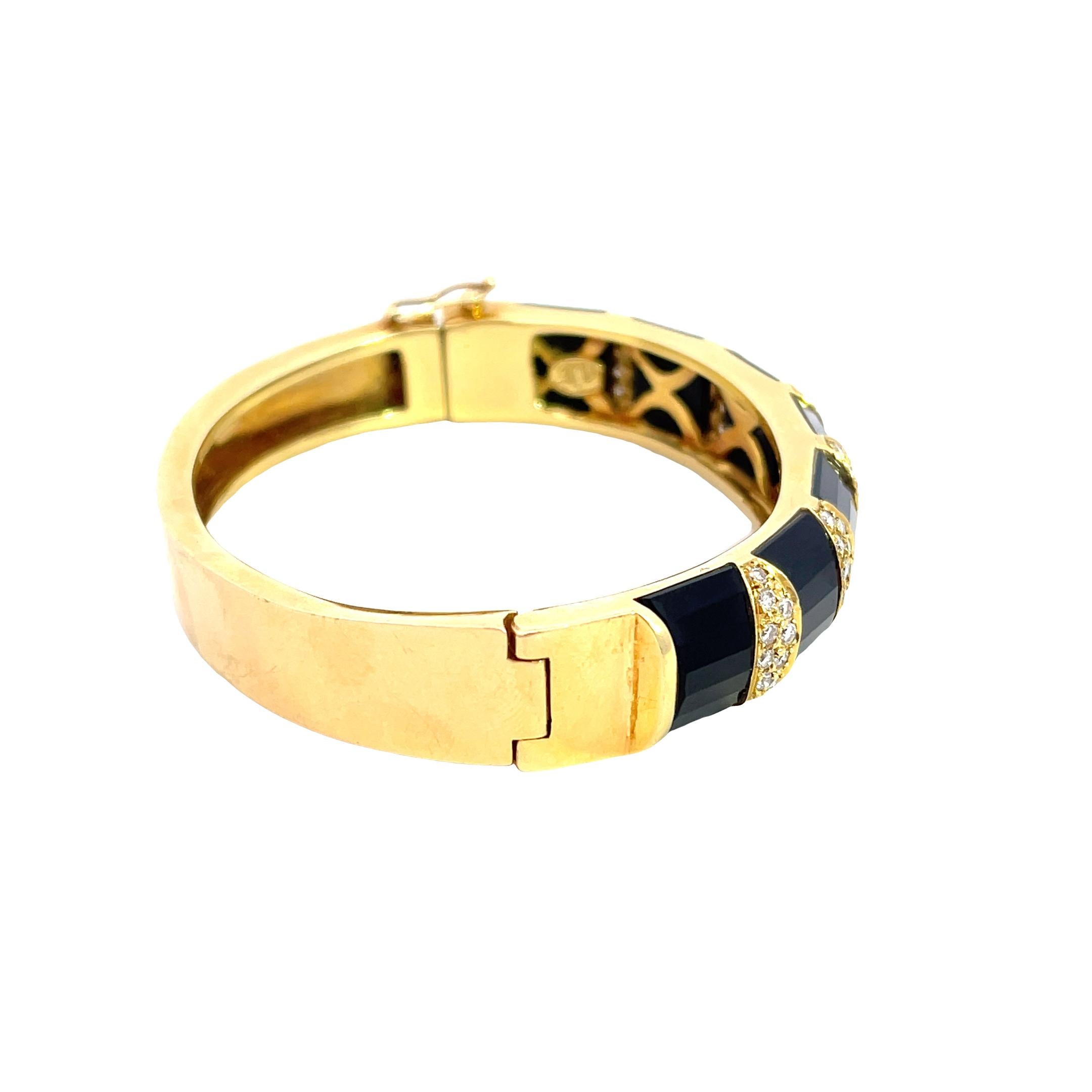 Introducing our exquisite 18K Yellow Gold 48.30 gram Diamond and Onyx Cuff Bangle, a dazzling addition to your jewelry collection. An Impressive piece of jewelry will definitely make a statement. Made from lustrous 18K yellow gold, the Bangle