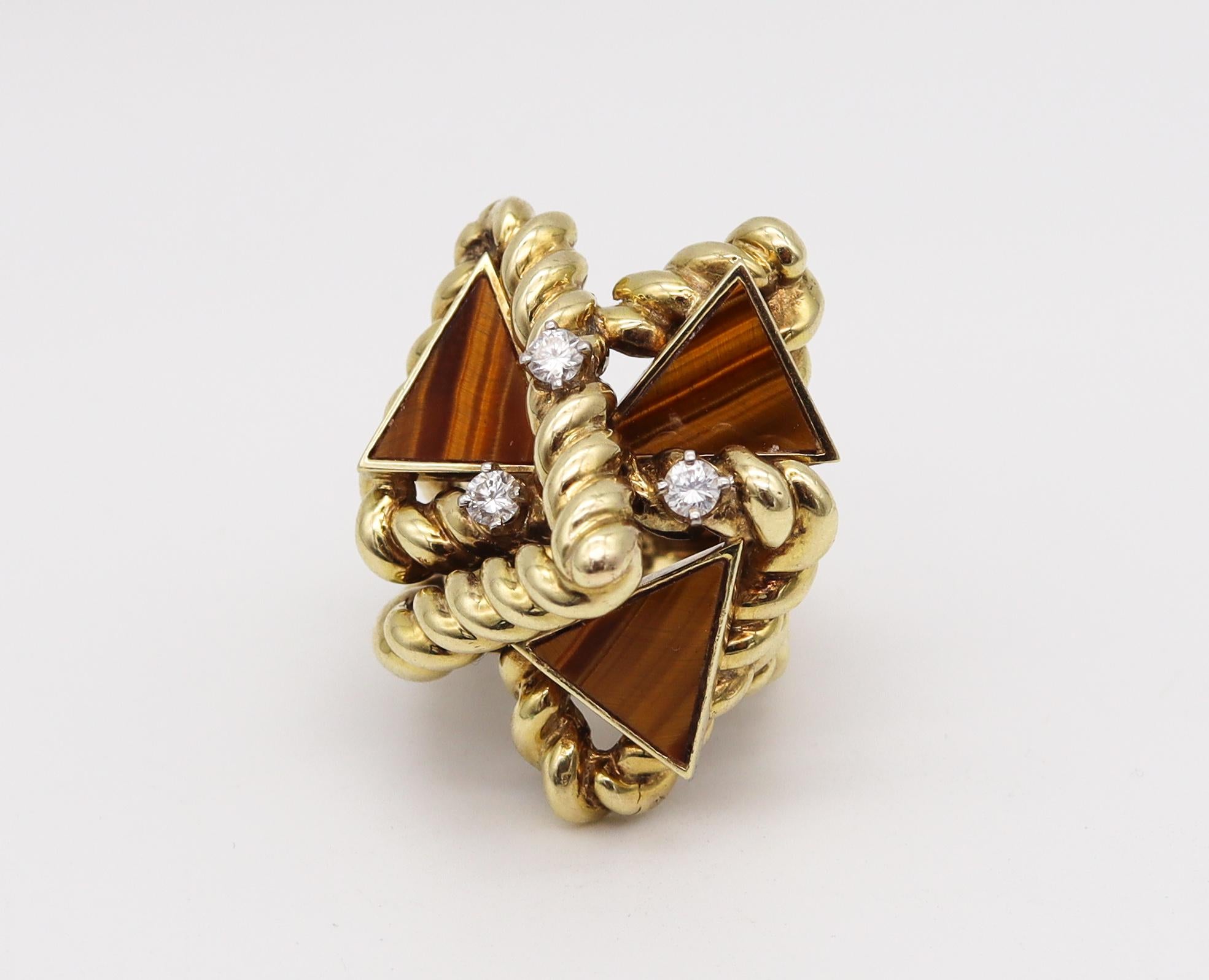 Geometric cocktail ring designed by La Triomphe.

A modernist three-dimensional sculptural piece, designed in New York city by the jewelry designer's La Triomphe, back in the early 1970's. This bold geometric cocktail ring has been crafted with