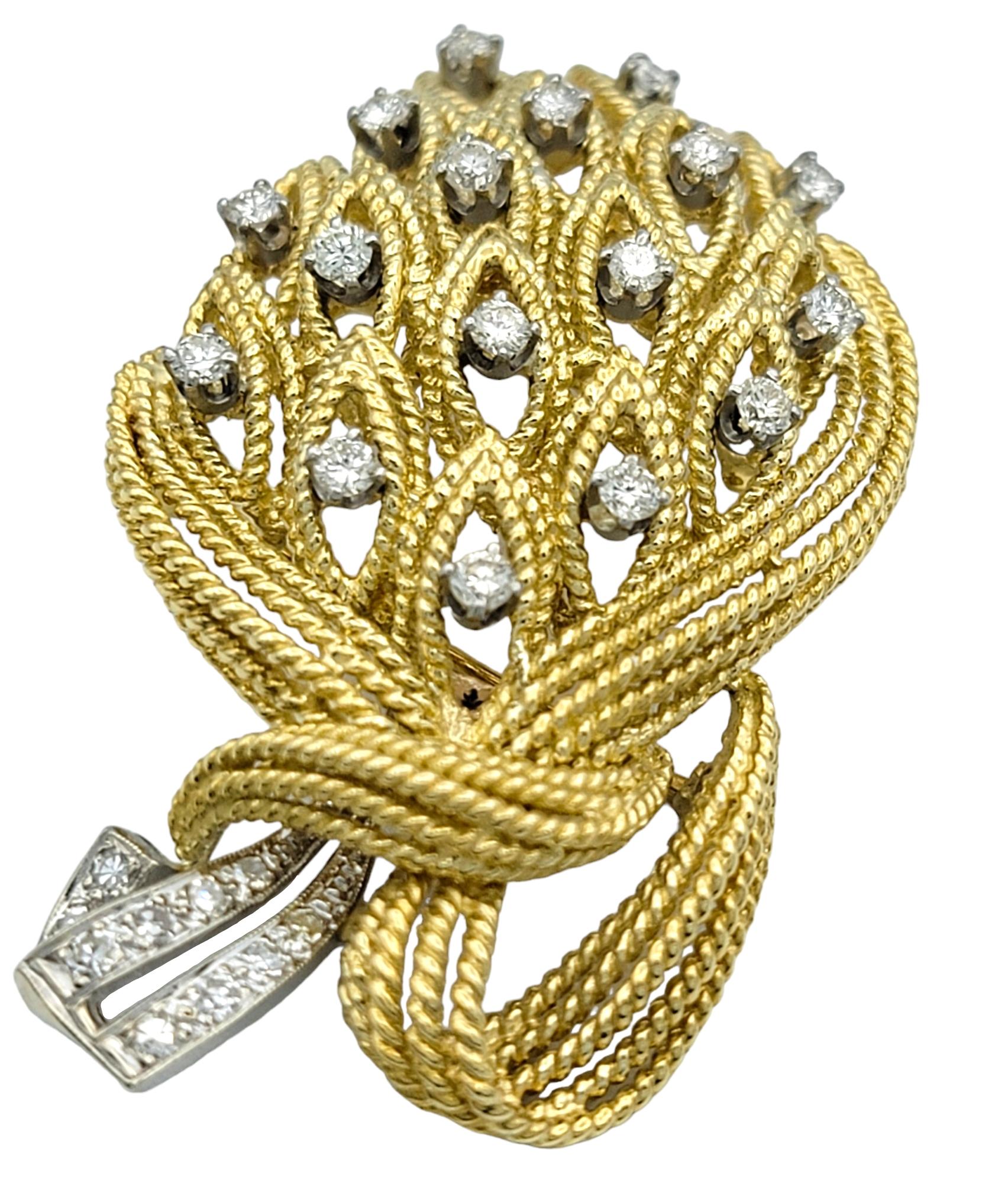 This dazzling diamond bouquet brooch by La Triomphe is a masterpiece of elegance and luxury. This piece is meticulously crafted in 18 karat yellow and white gold. This exquisite brooch features a sparkling array of diamonds arranged throughout the
