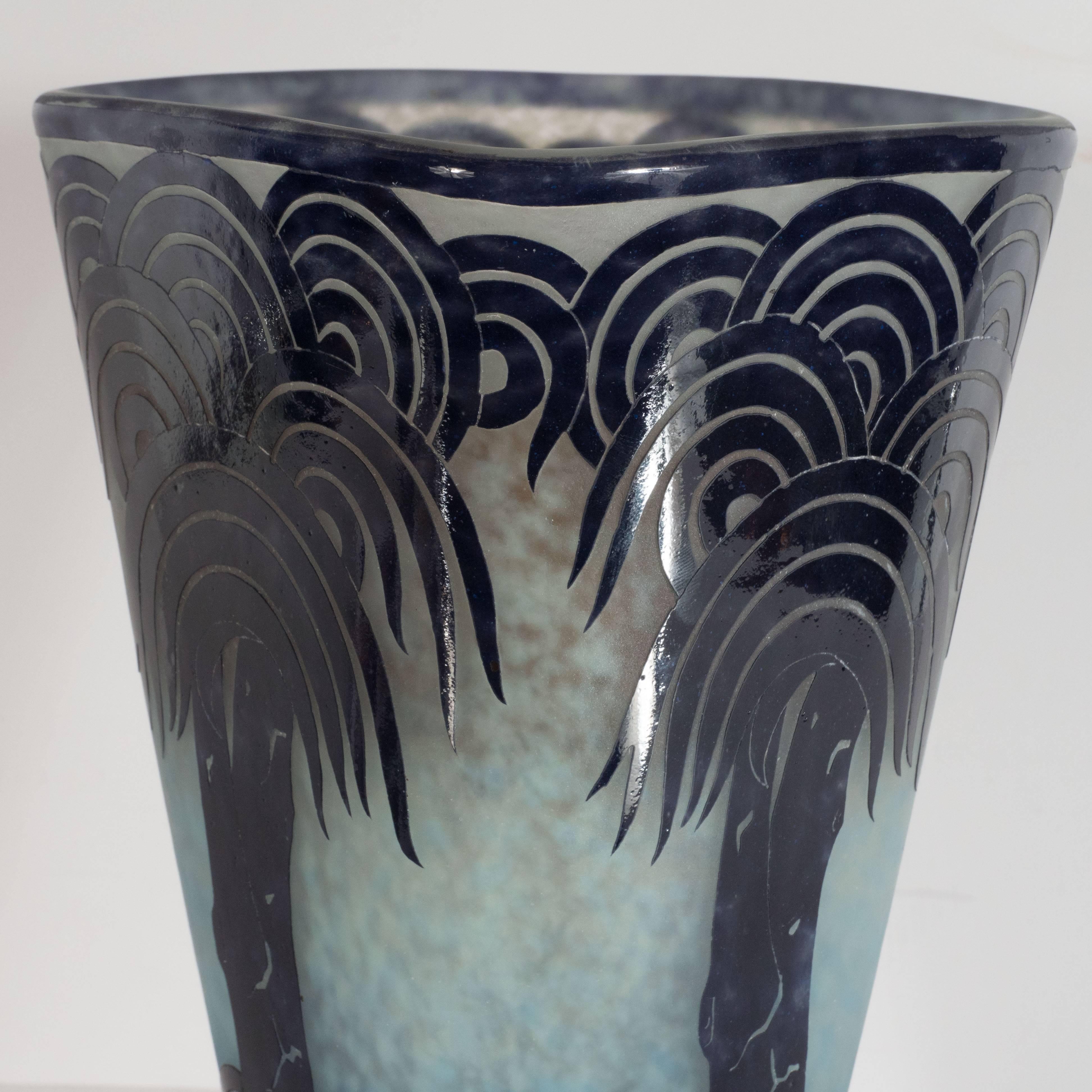 This rare cameo glass vase was realized by Charles Schneider- one of the most illustrious and influential glass blowers of the period in France, circa 1930. It is part of his celebrated 