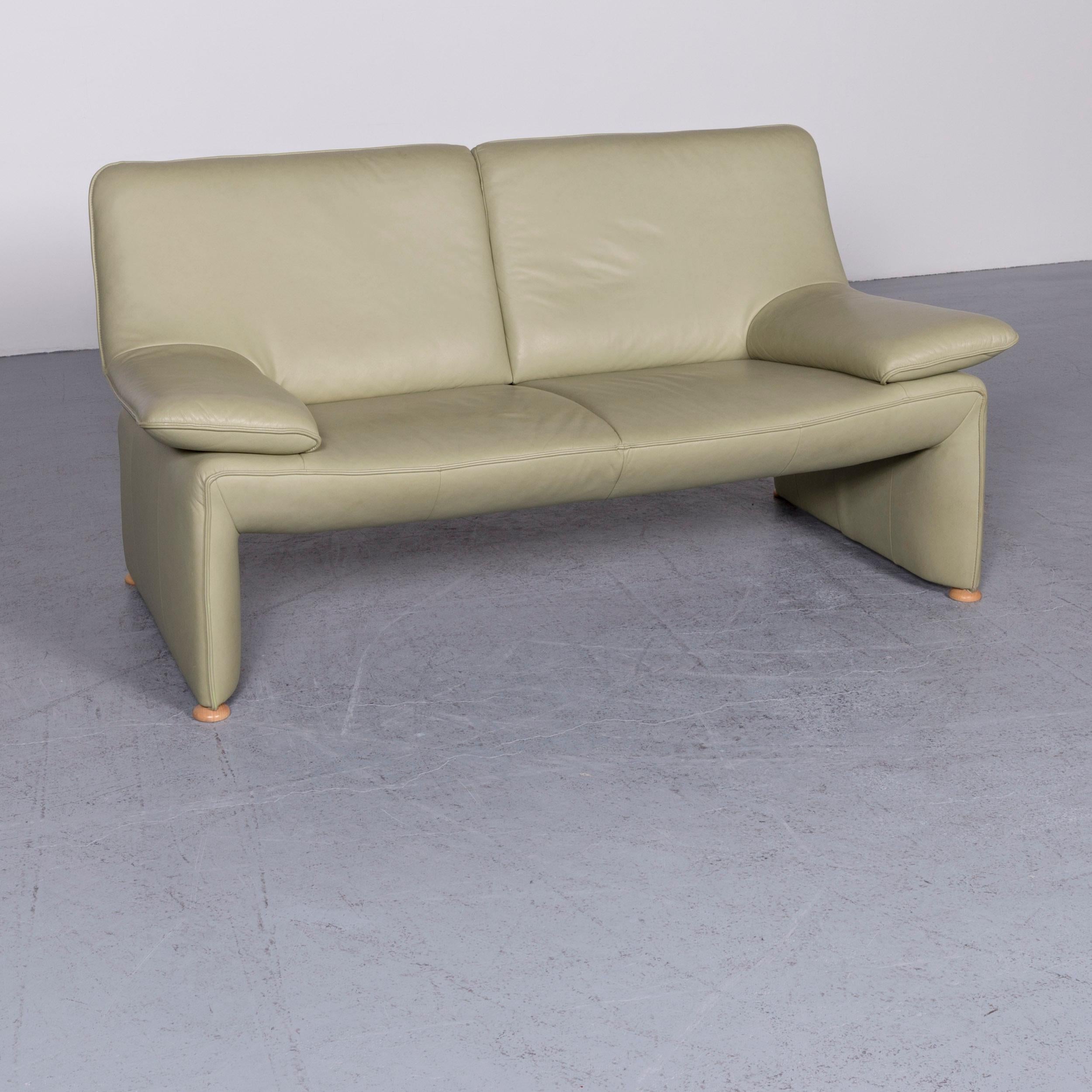 We bring to you a Laauser Flair designer sofa leather green two-seat couch modern.