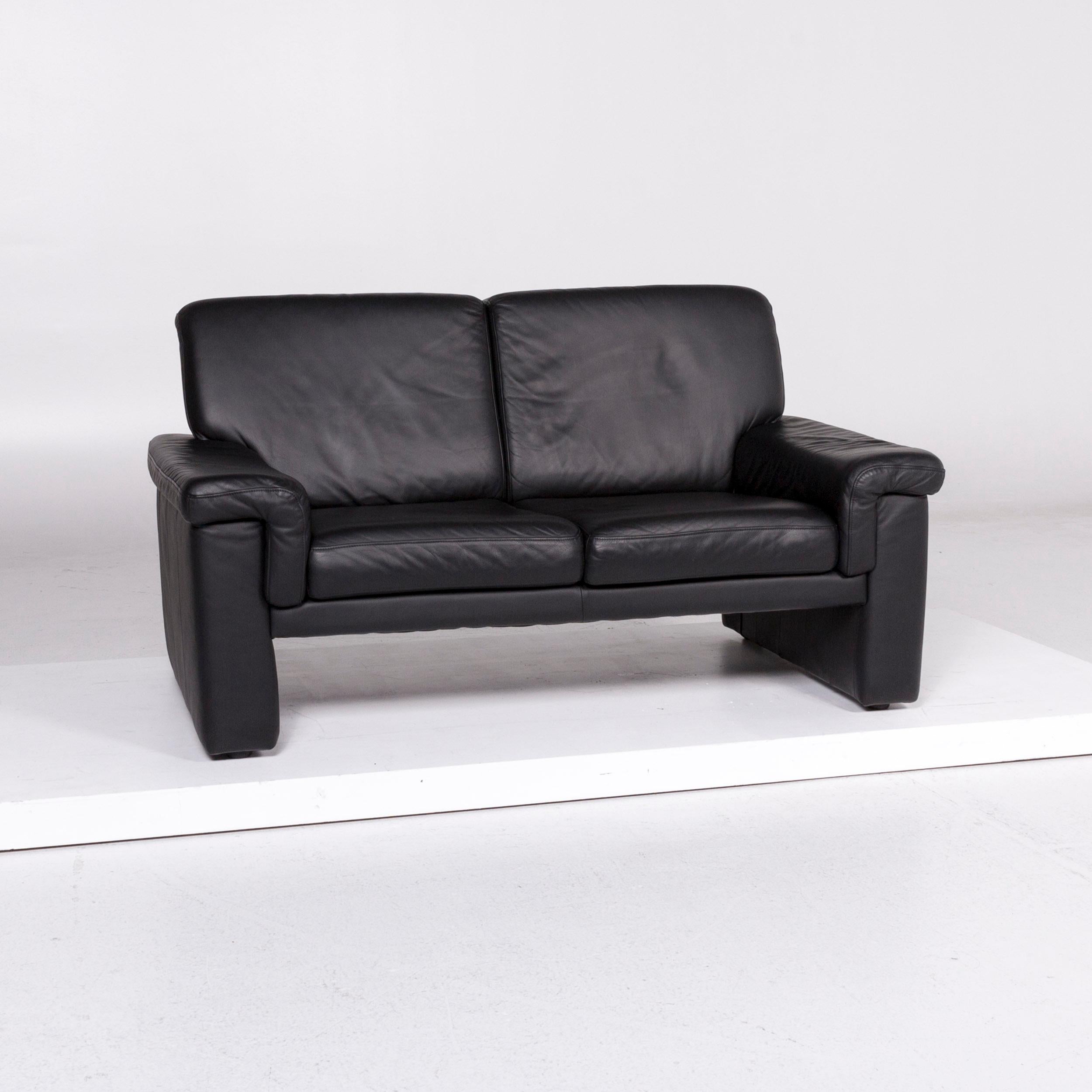 We bring to you a Laauser leather sofa black two-seat couch.
 
 Product measurements in centimeters:
 
Depth 87
Width 146
Height 83
Seat-height 41
Rest-height 50
Seat-depth 55
Seat-width 102
Back-height 42.
     
