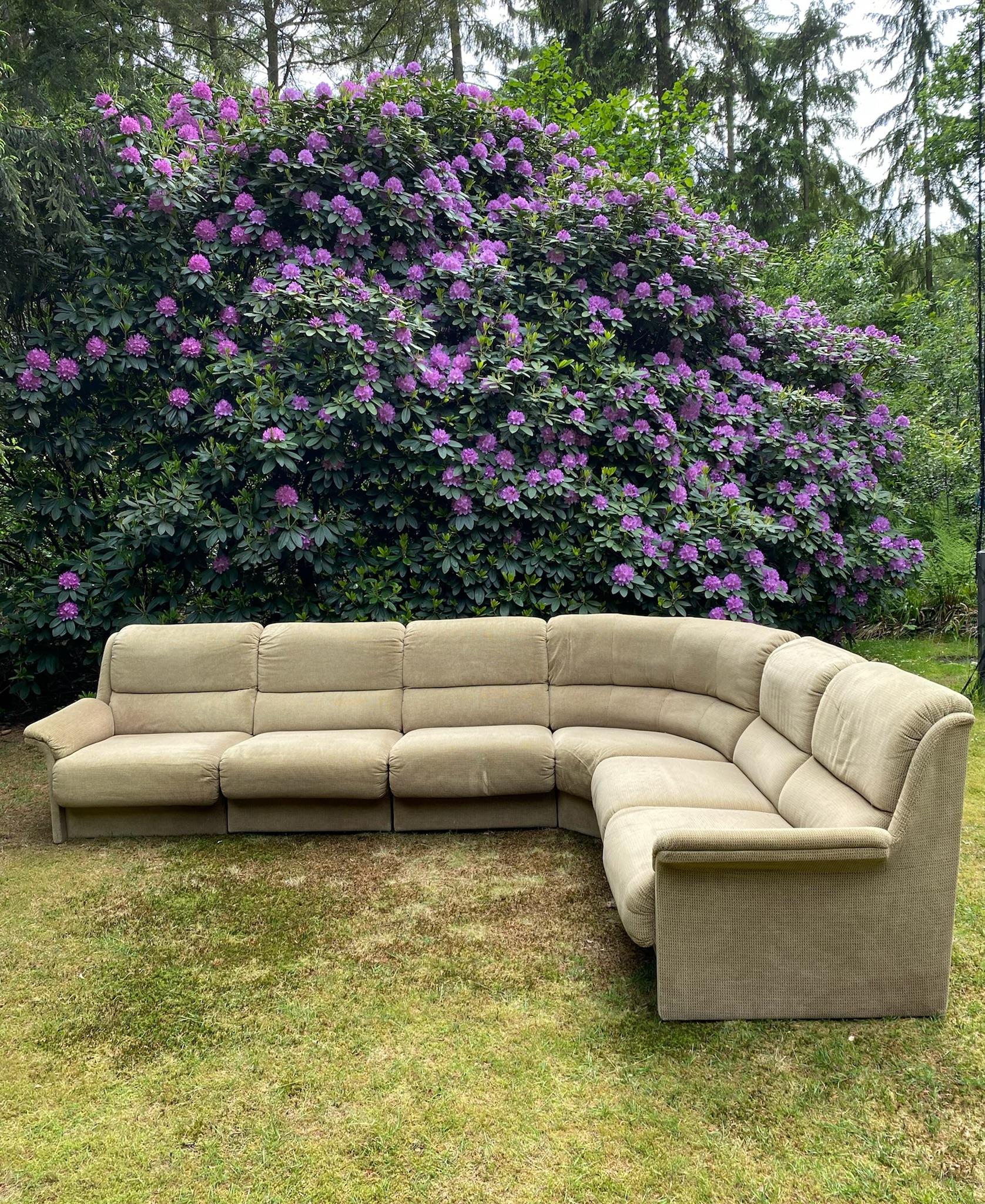 Wonderful comfortable sectional sofa, manufactured by Laauser Switzerland in ca. the 1960s. The sofa consists of six parts and comes with the original Green/Brown Velvel like fabric, which feels soft and offers good comfort. This modular piece