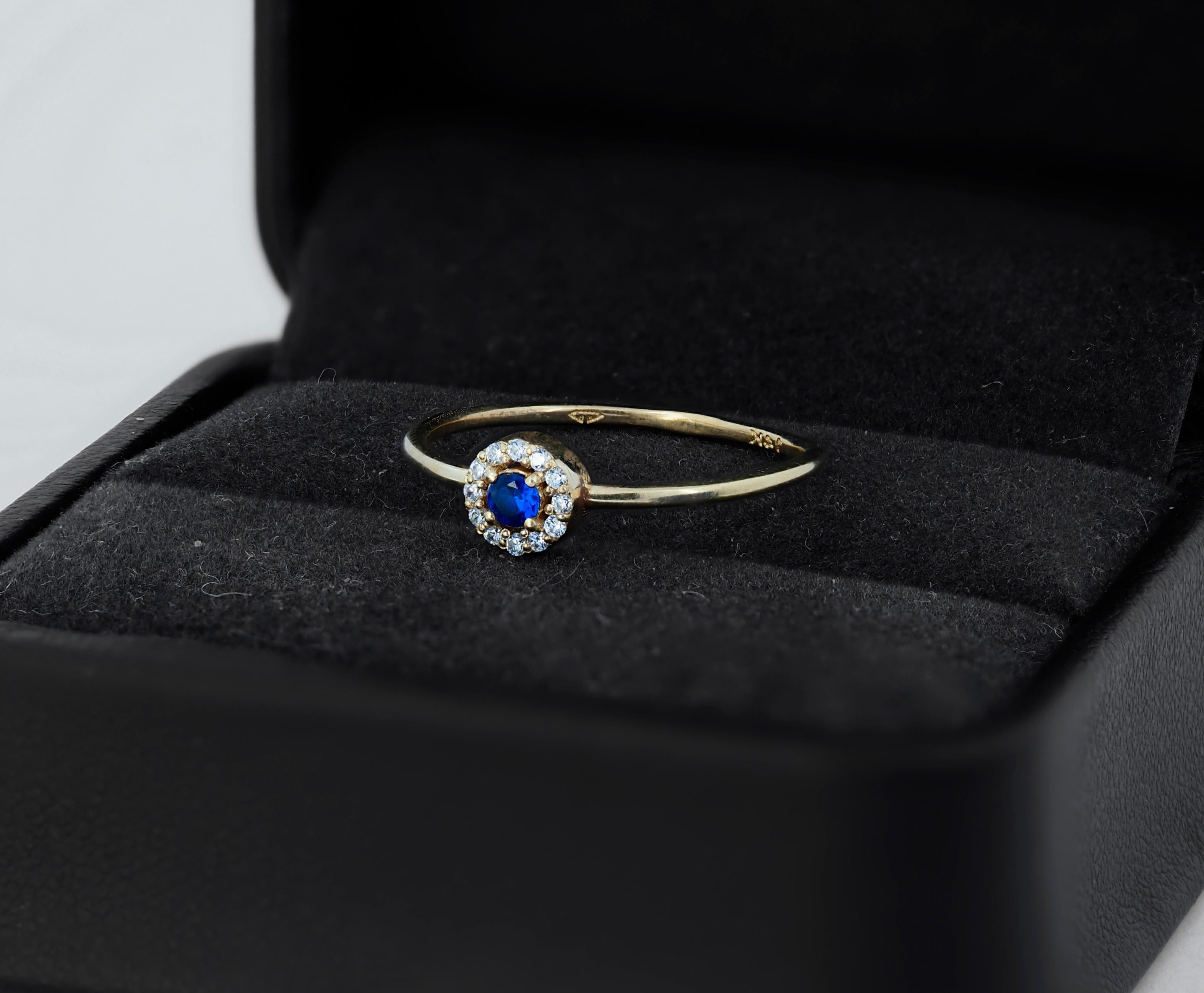 Modern Lab blue sapphire, moissanites halo 14k gold ring.