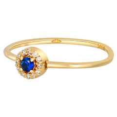 Lab blue sapphire, moissanites halo 14k gold ring.