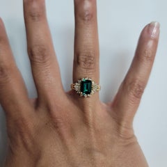 Lab Generated Emerald with Diamond Halo Engagement Ring
