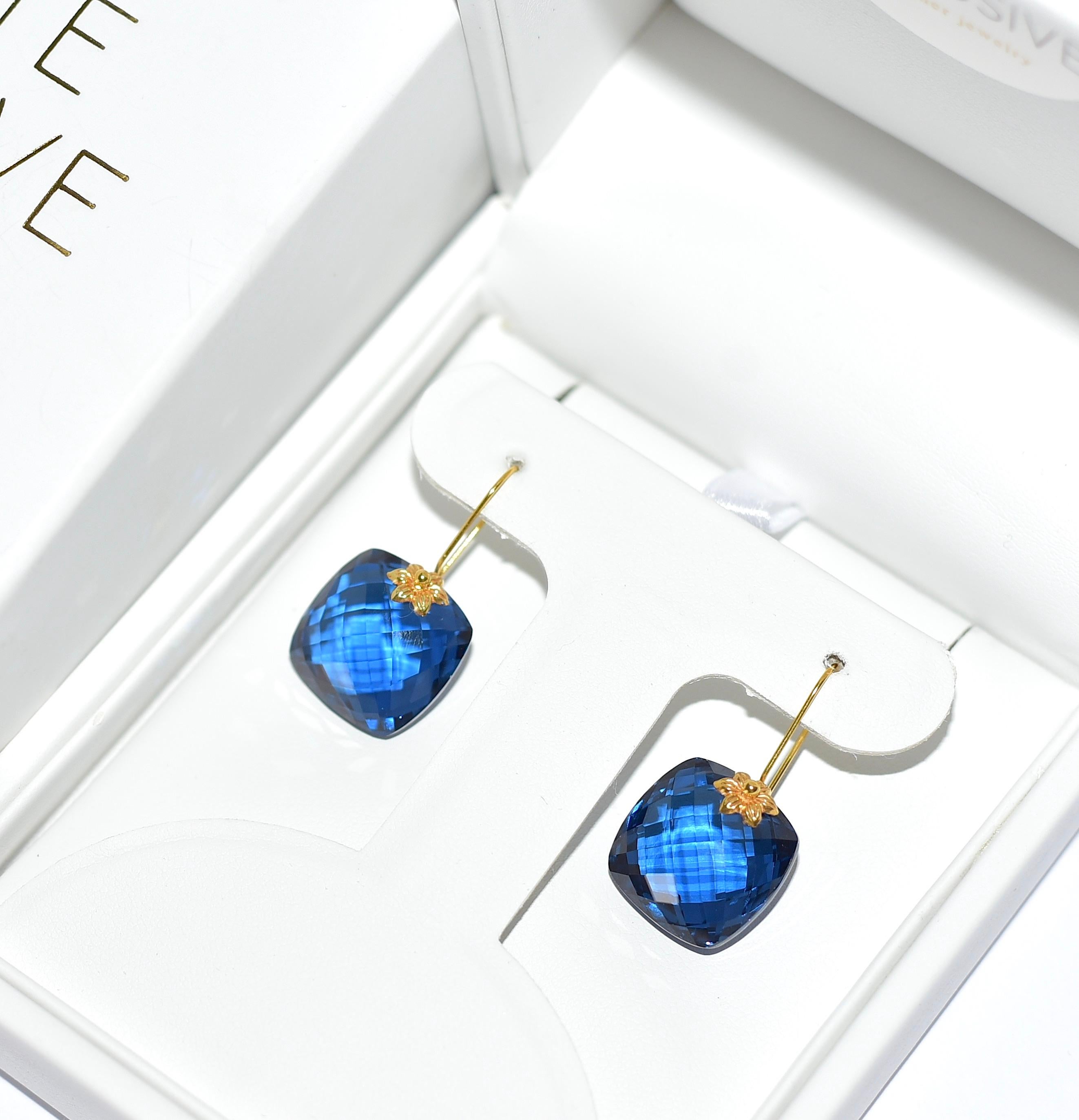 This unique pair of lab-created London Blue Topaz earrings are like a goddess! 18K Solid Yellow Gold delicate details give the earrings a feminine look. Simple sophistication for your everyday accessories! The perfect gift for the holidays! Super