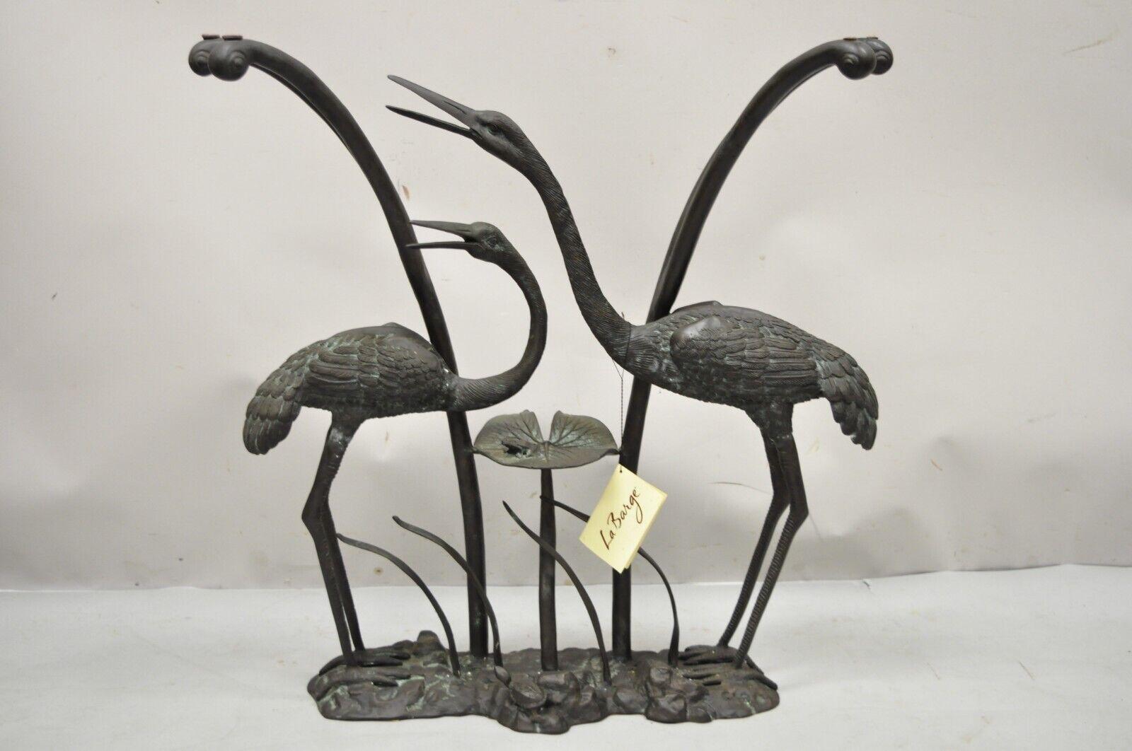 Labarge bronze crane bird lily pad glass top console sofa hall table. Item features a cast bronze base with crane birds and a frog on a lily pad, shaped glass top, desirable patina to metal. Circa 1980. Measurements: 29.5