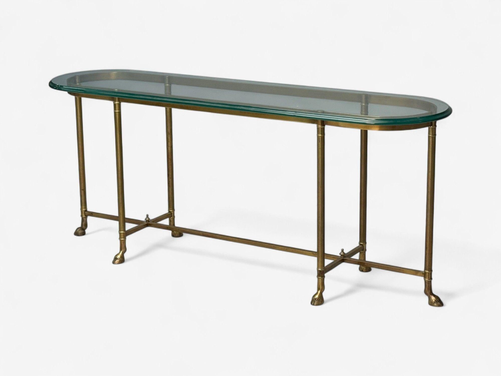 LaBarge, German Modern, Brass, Glass, Console Table, Germany, 1970s

A long and narrow console table designed and produced by LaBarge in the second half of 20th century Germany. This example features a thick beveled oval glass top sitting on a