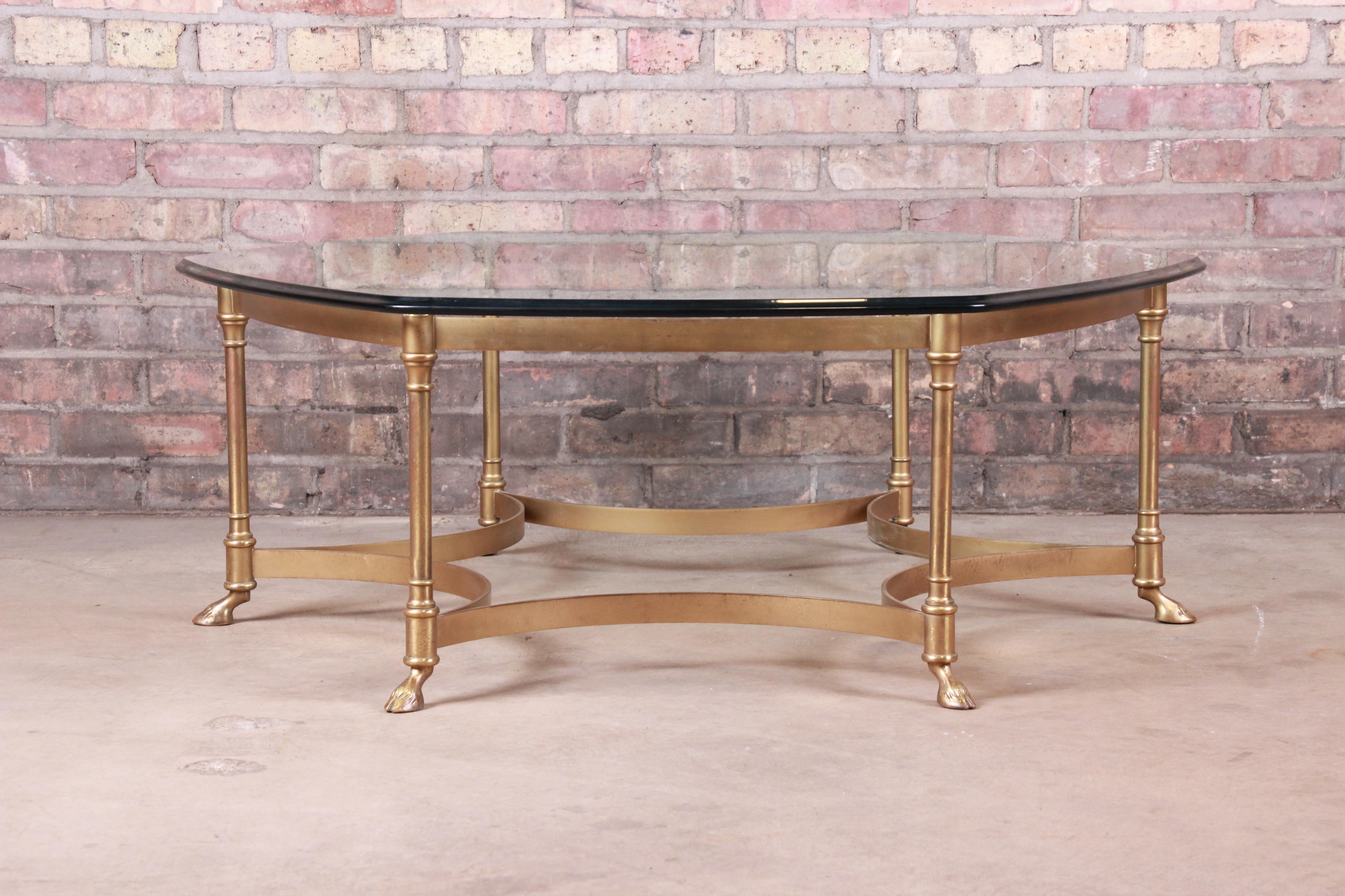 A gorgeous Mid-Century Modern Hollywood Regency hexagonal hooved feet coffee or cocktail table

By Labarge

circa 1960s

Solid brass frame, with beveled glass top.

Measures: 42.38
